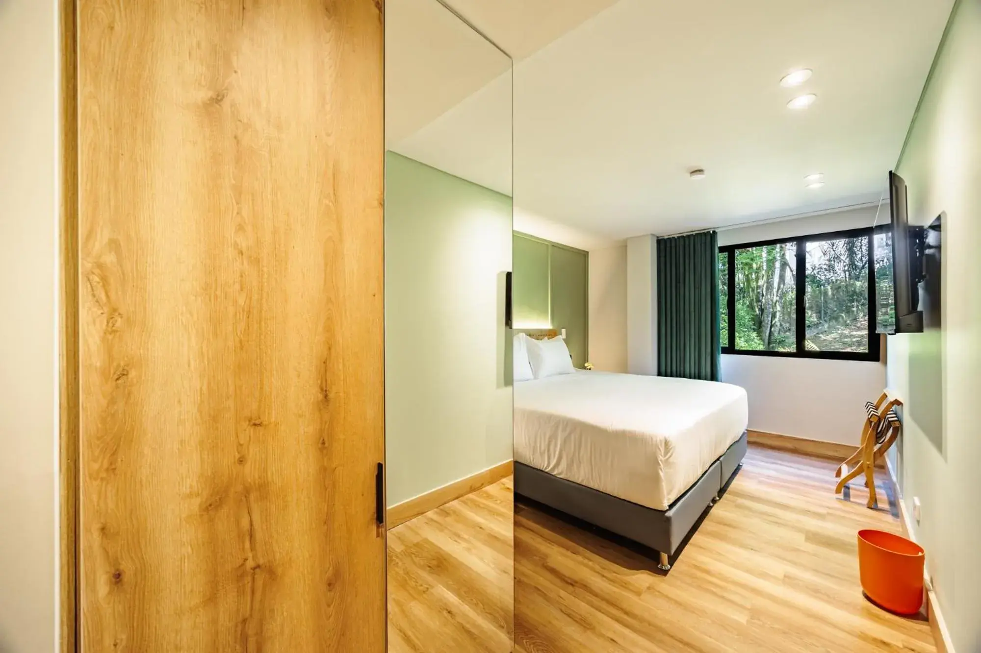 Quiet street view, Bed in The Somos Central Hotel Poblado Quiet street view, Bed in The Somos Central Hotel Poblado