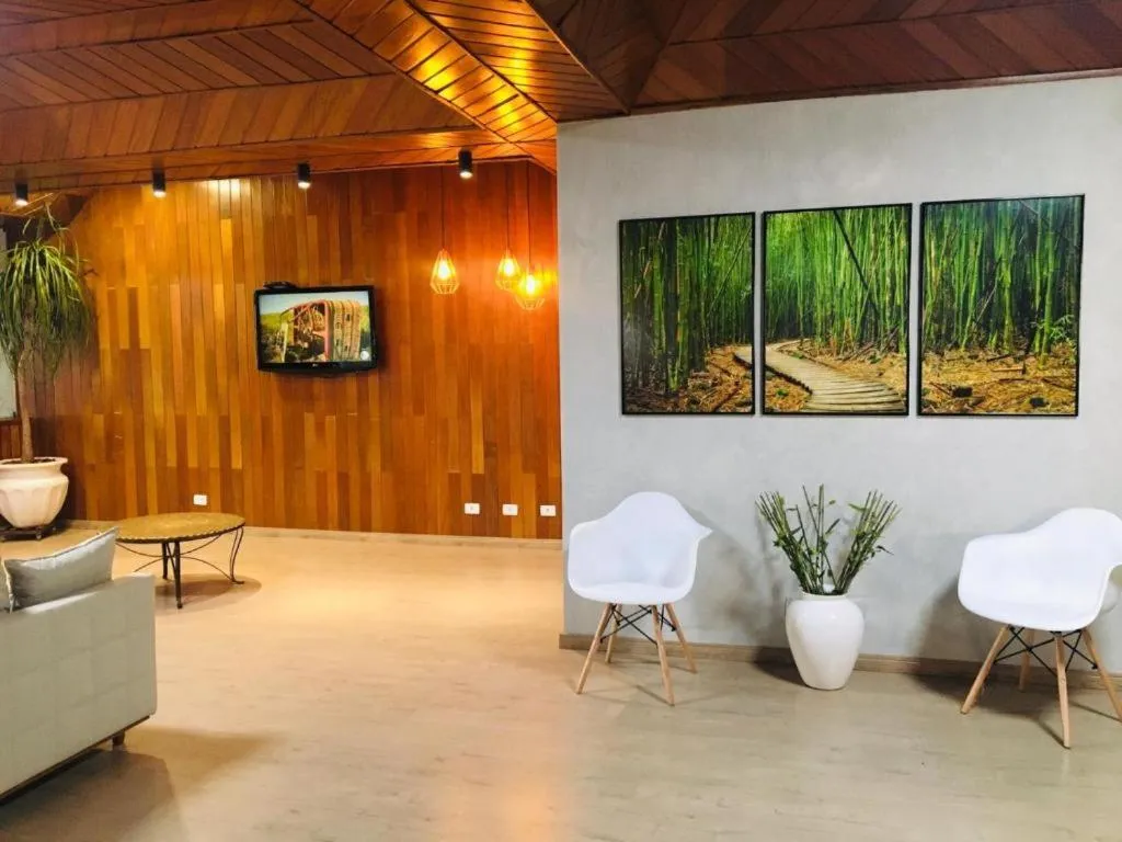 Communal lounge/ TV room in GoldMen Select Maringá