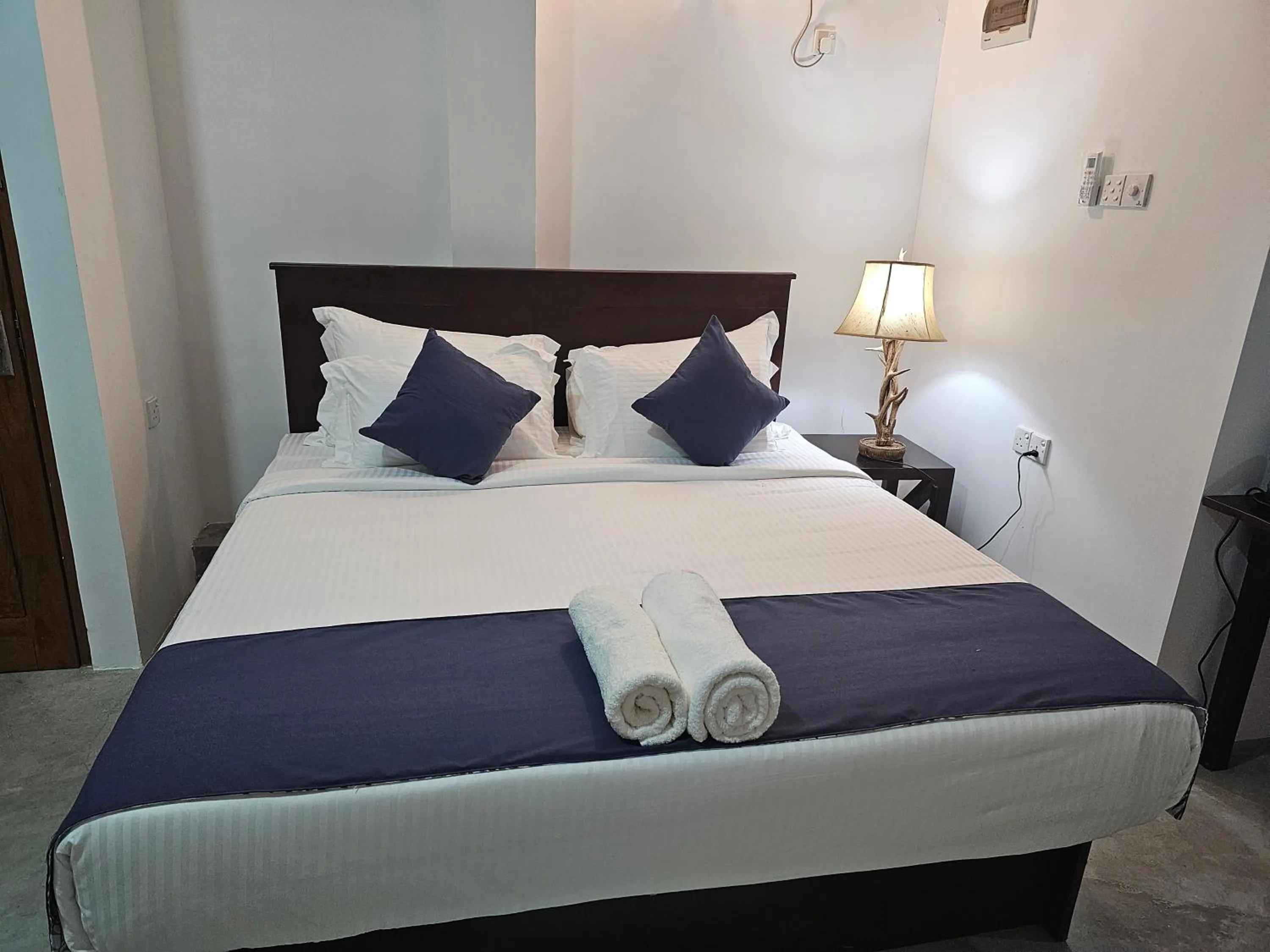 Bed in Ellakanda Nature Villa