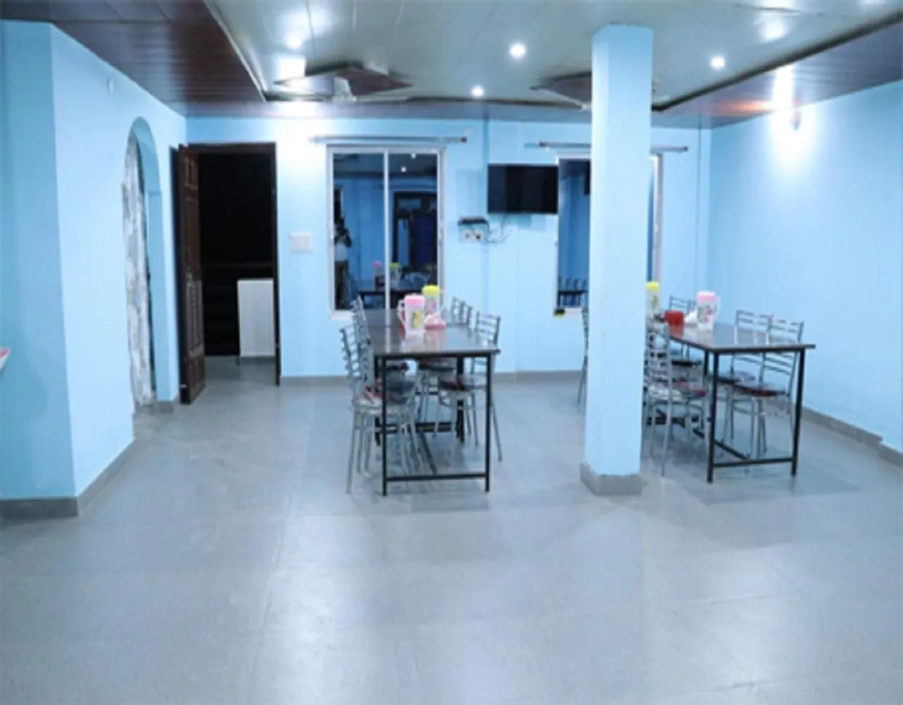 Dining area in Hotel Prakash by StayApart