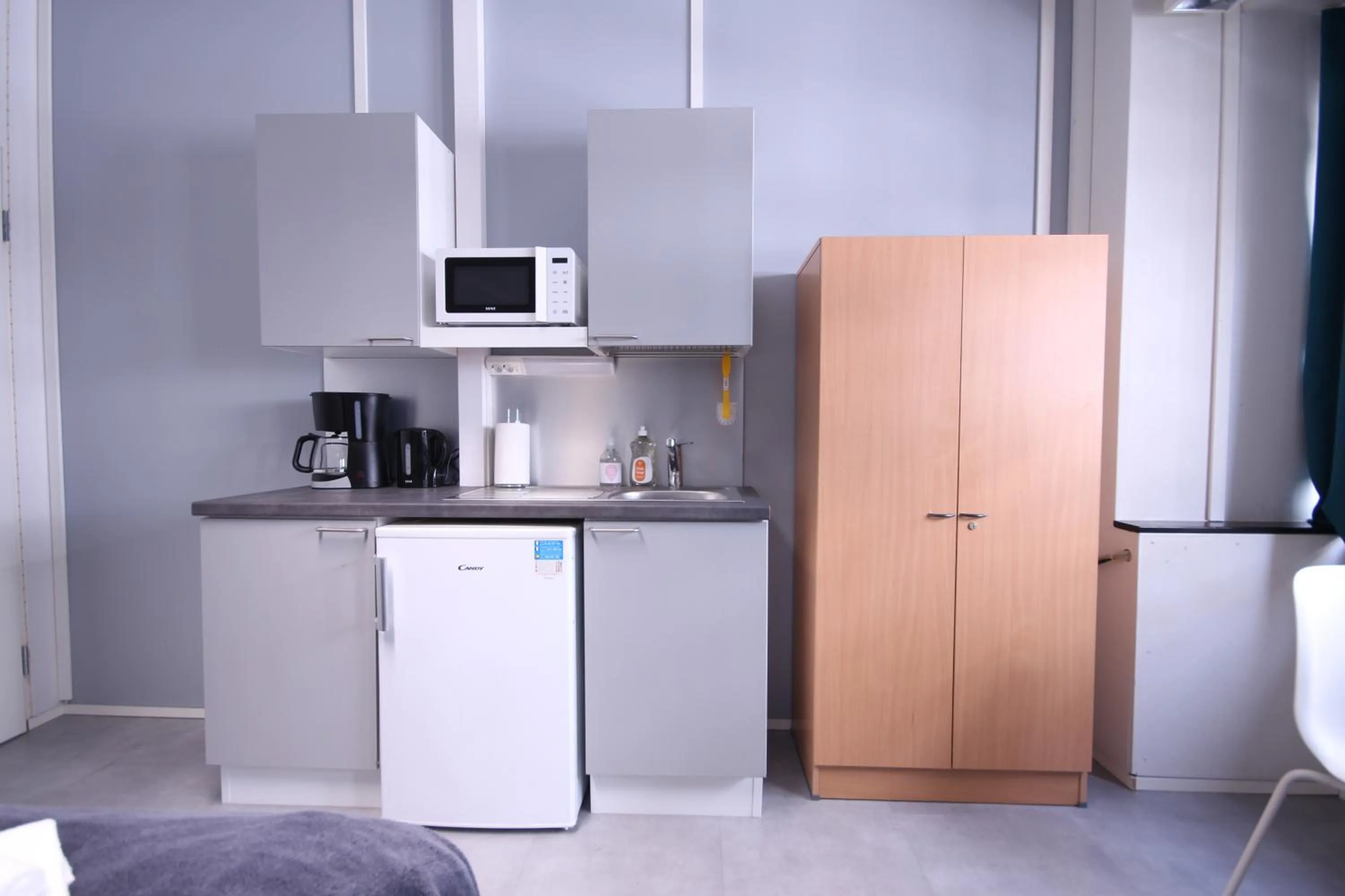 Kitchen or kitchenette in Forenom Hostel Espoo Kilo