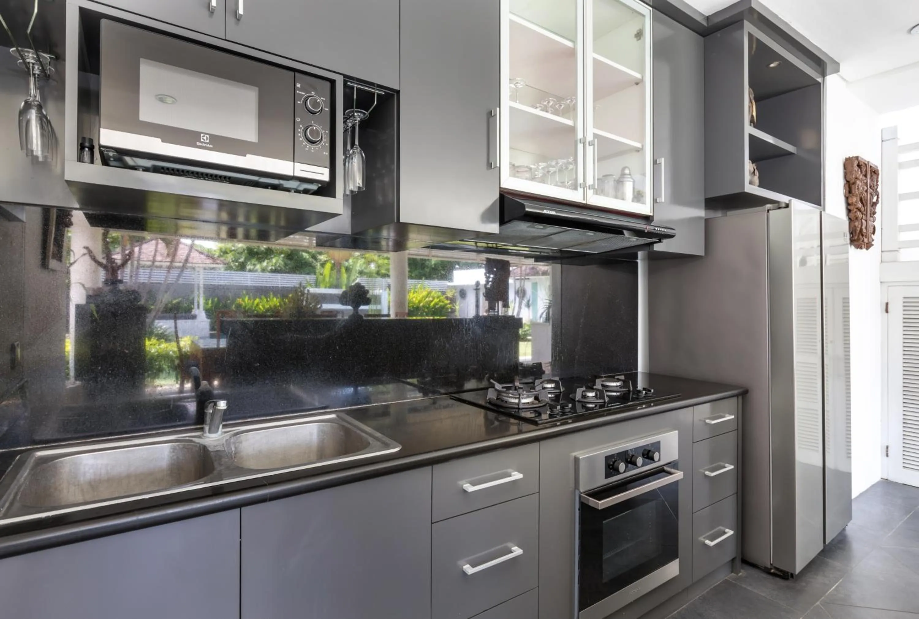 Kitchen or kitchenette in Kerta Rama Seminyak by Kerta Living