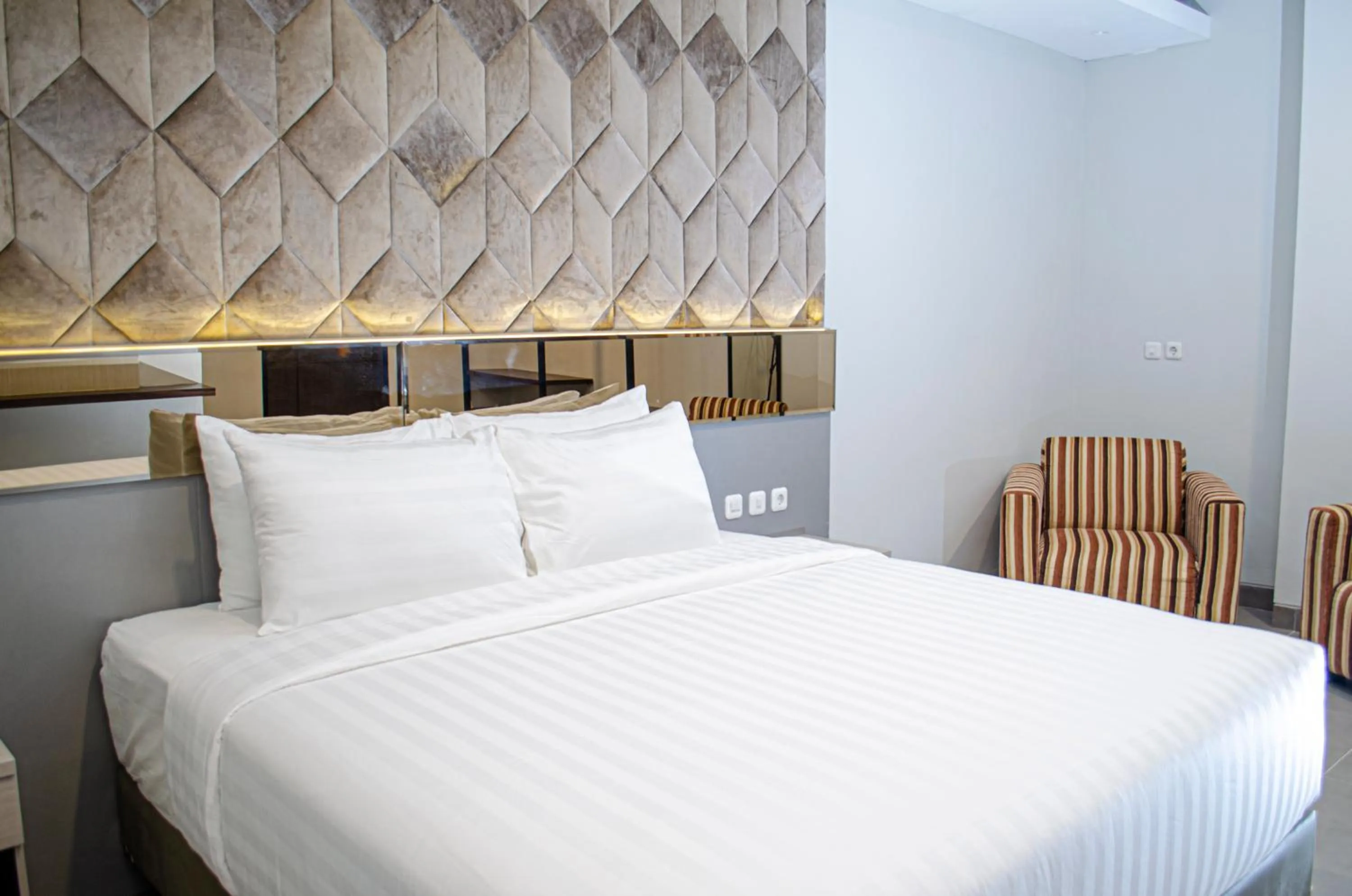 Bed in Arcadia Hotel Manado