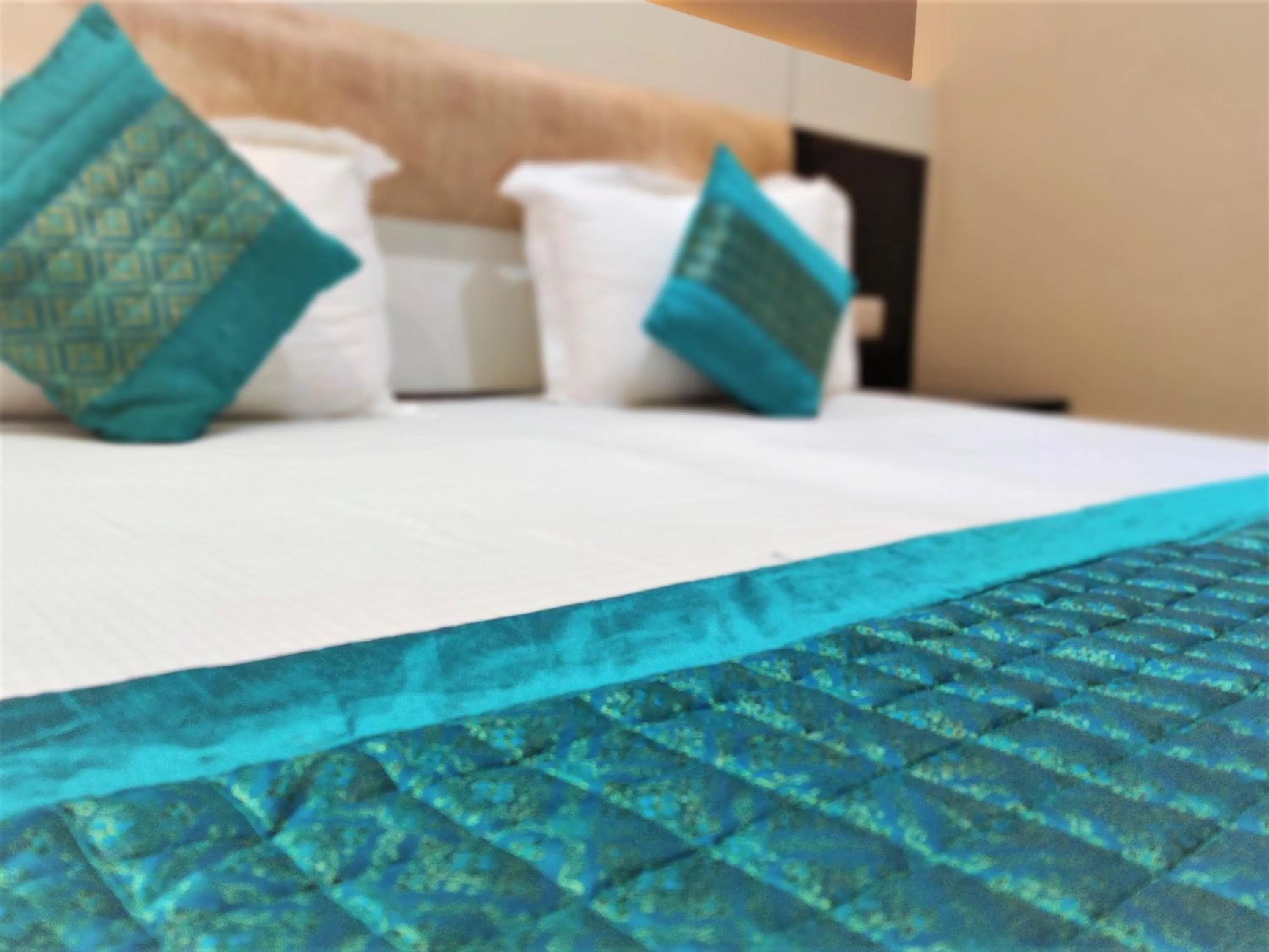 Bed in Raj Mahal Inn