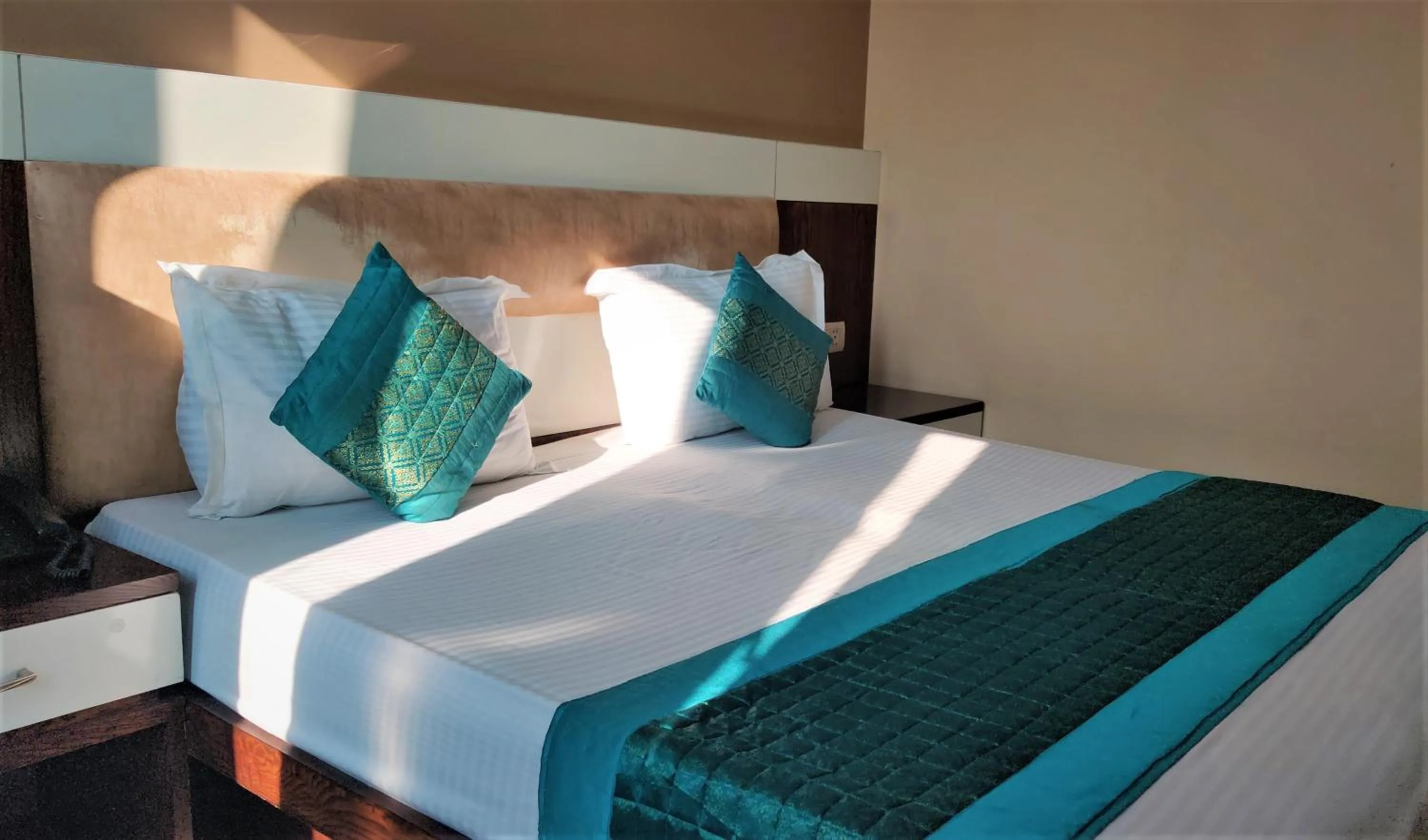 Bed in Raj Mahal Inn