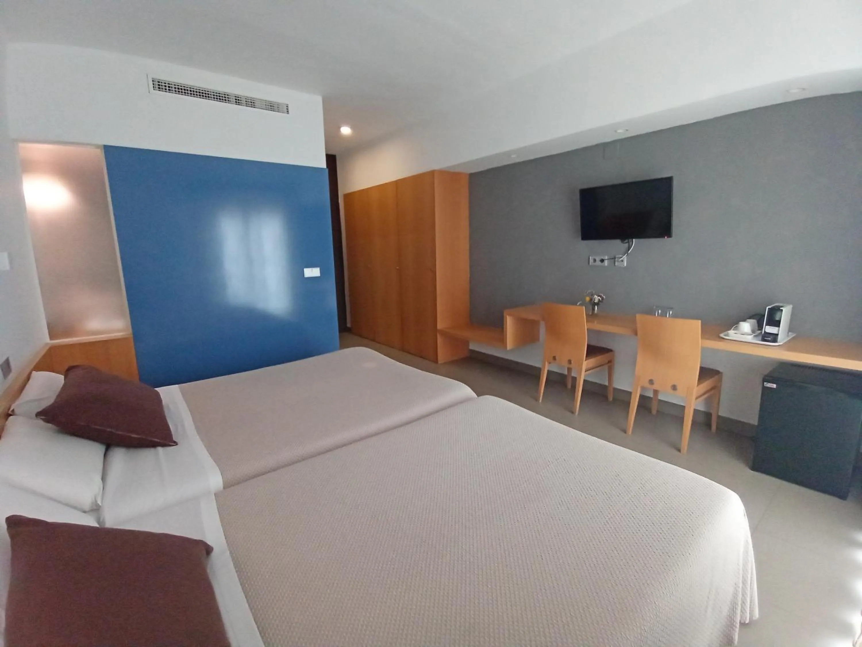 Bed in Hotel Alboran