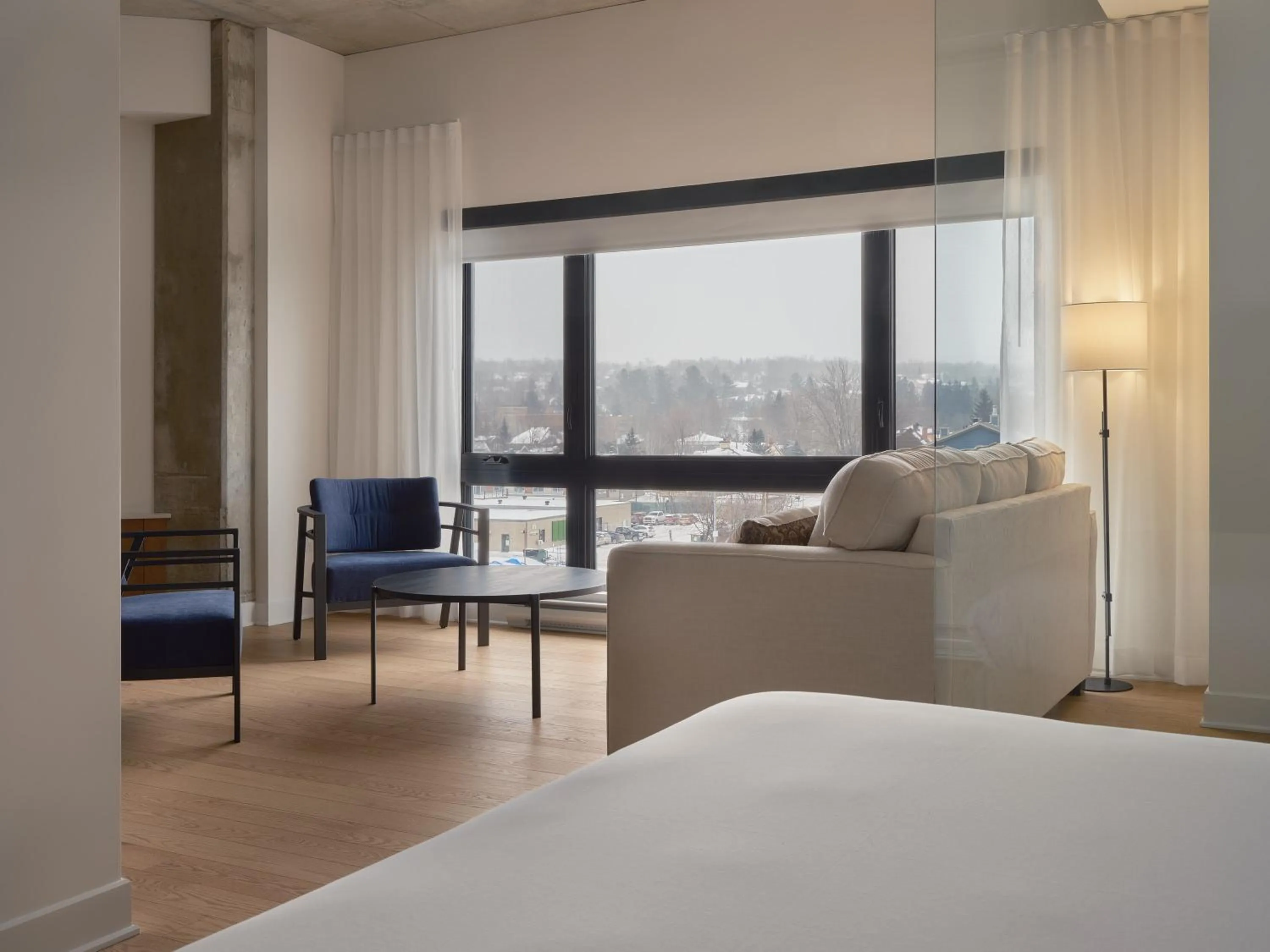 Living room, Bed in Hôtel Expérience - Quartier Des Marinas