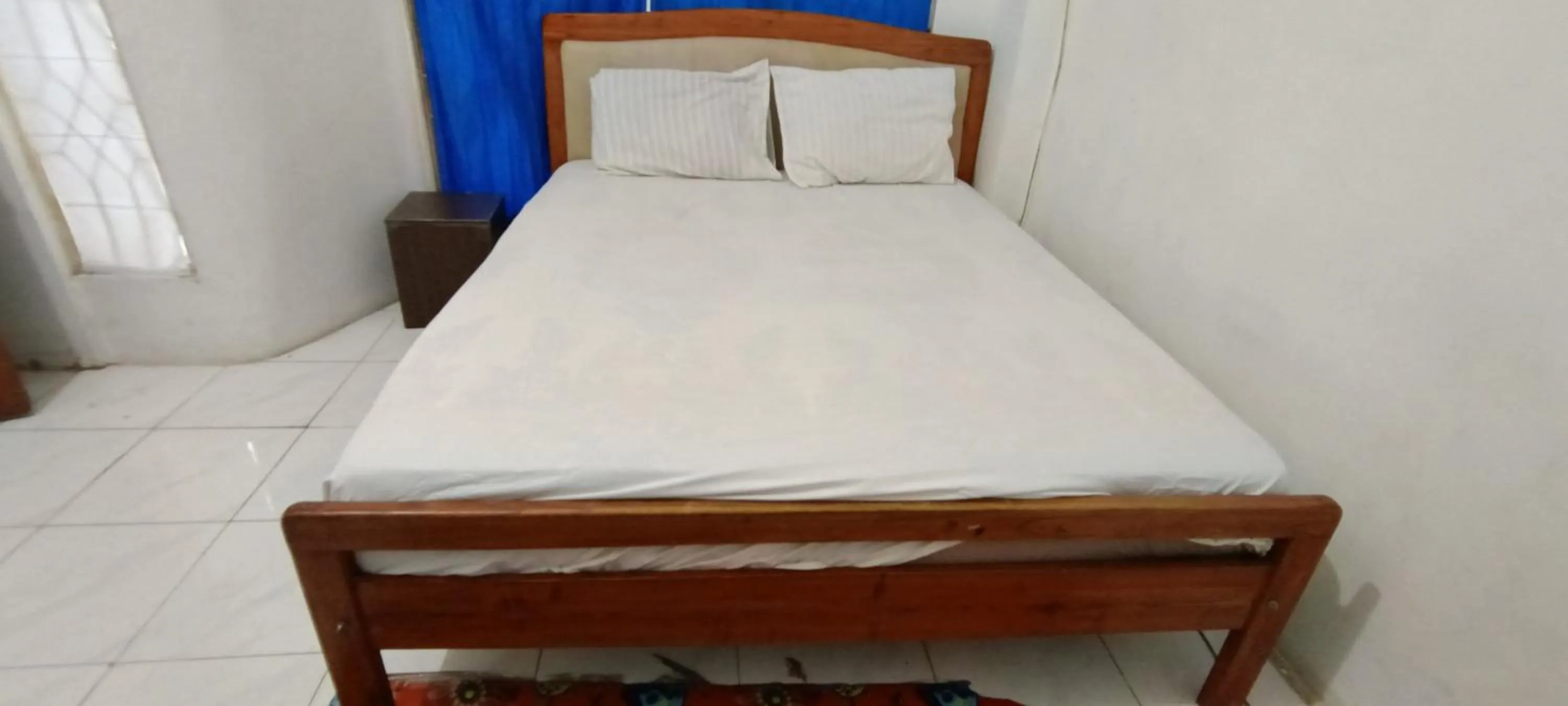 Bedroom, Bed in Hotel O Pondok Puti Sartika SyariahNearPasar Jum'at Aluh Aluh