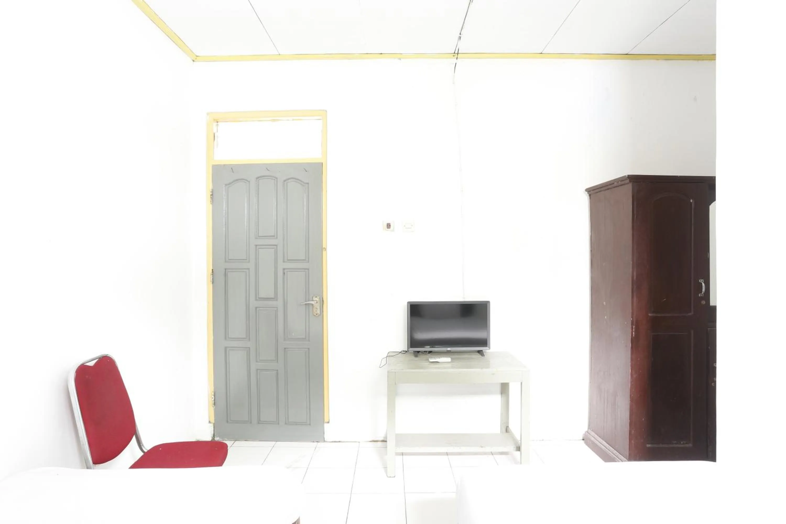 Bedroom in Hotel O Penginapan Budhe Sri