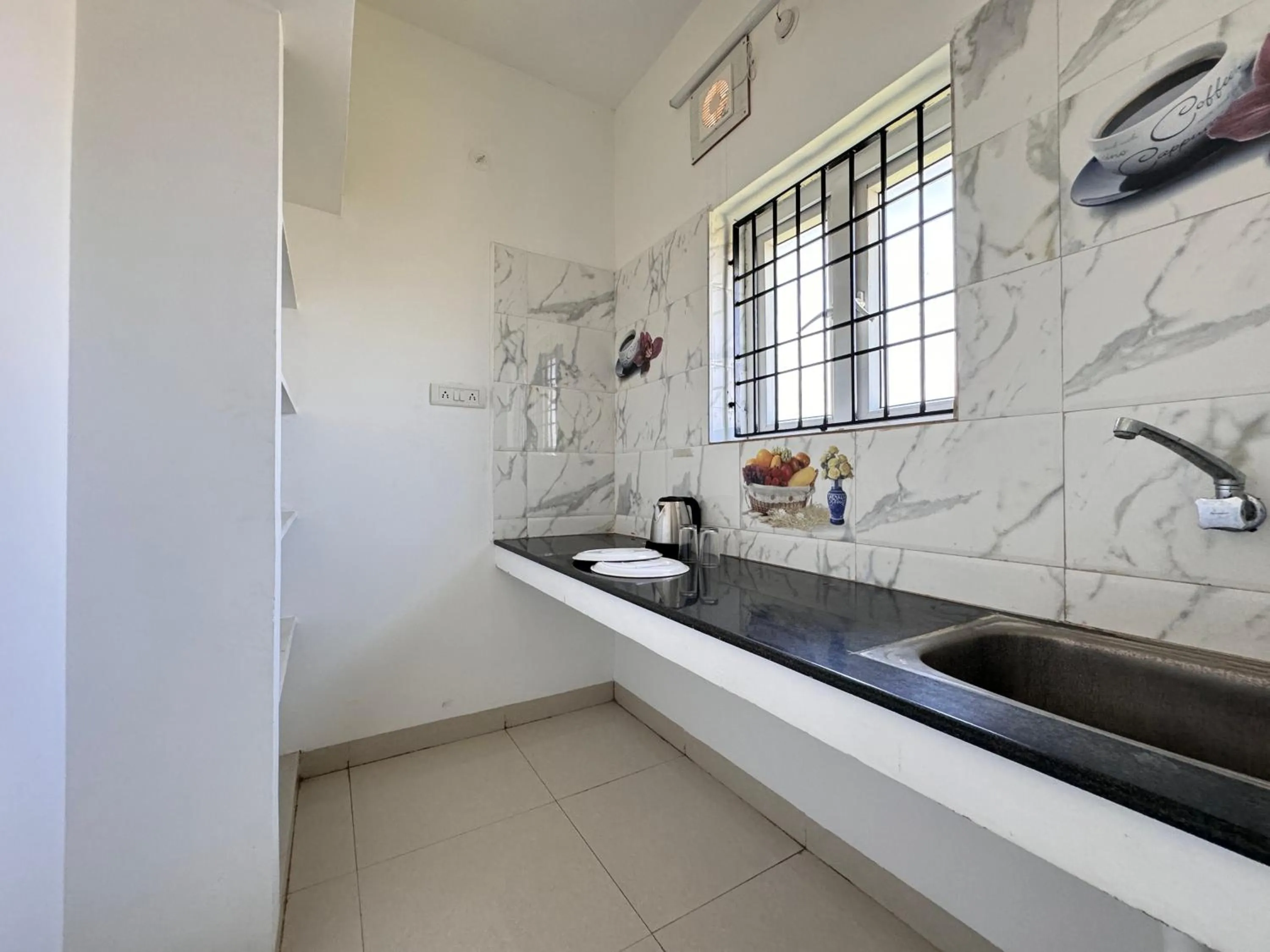 kitchen in Royal Beach Service Apartment