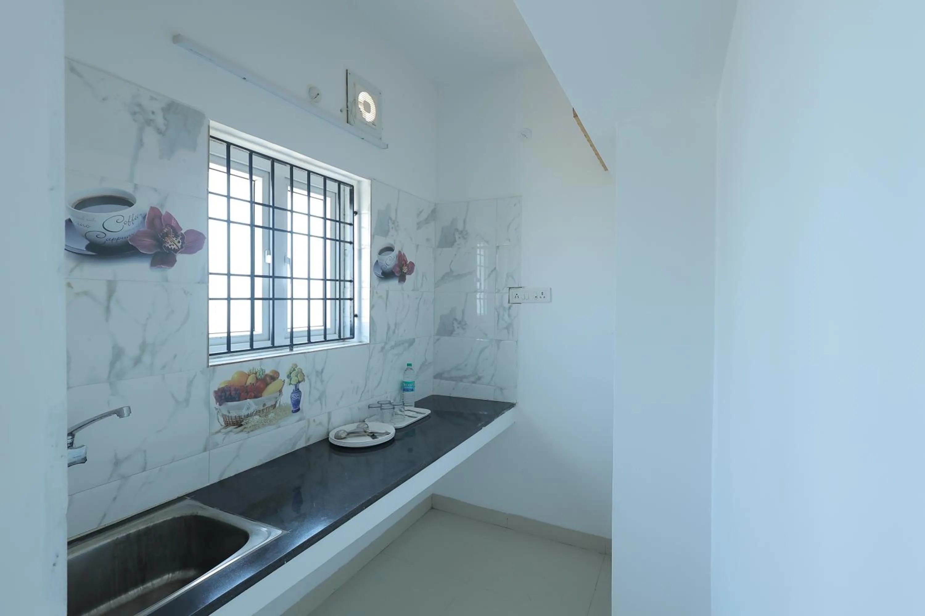 Kitchen or kitchenette in Royal Beach Service Apartment