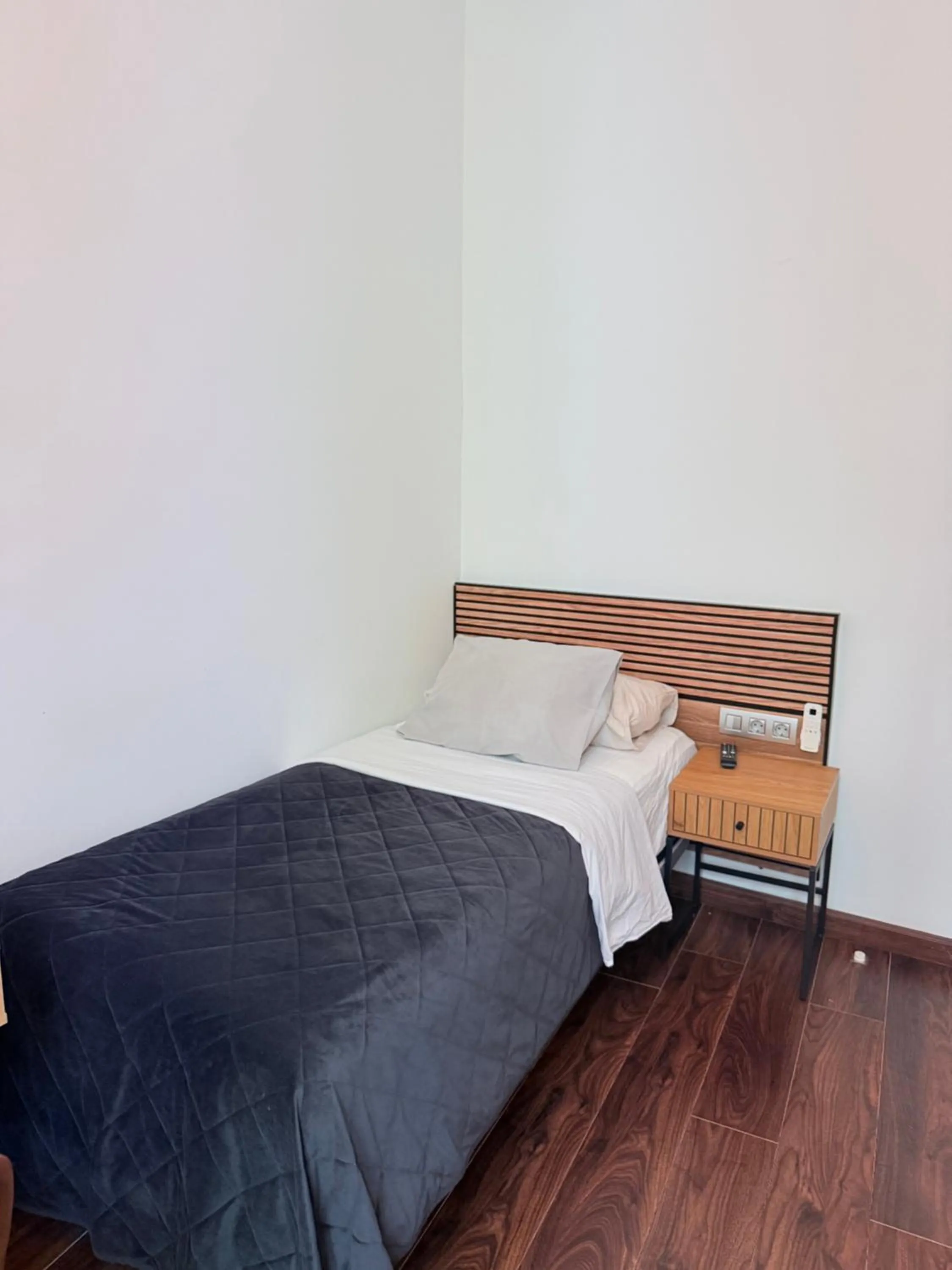 Bed in Triana Rooms EH