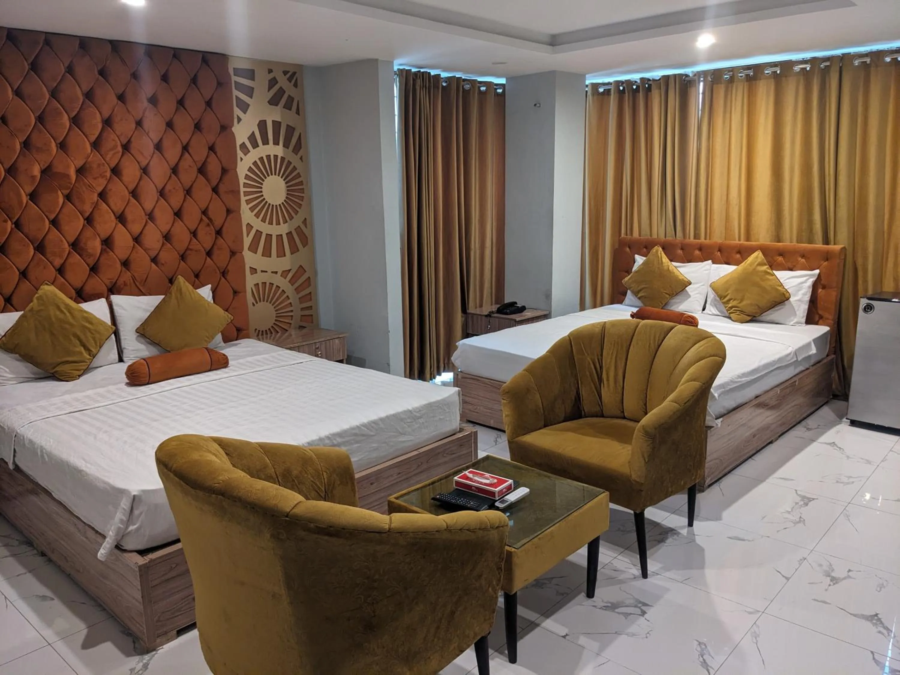 Seating area, Bed in Nuva Hotel