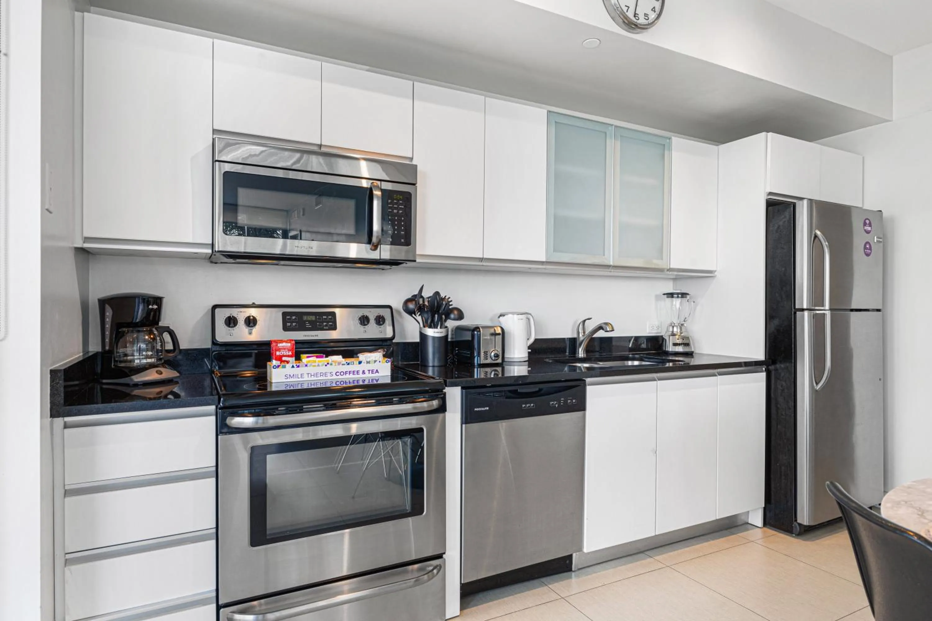 kitchen in Dharma Home Suites Miami Beach at Monte Carlo