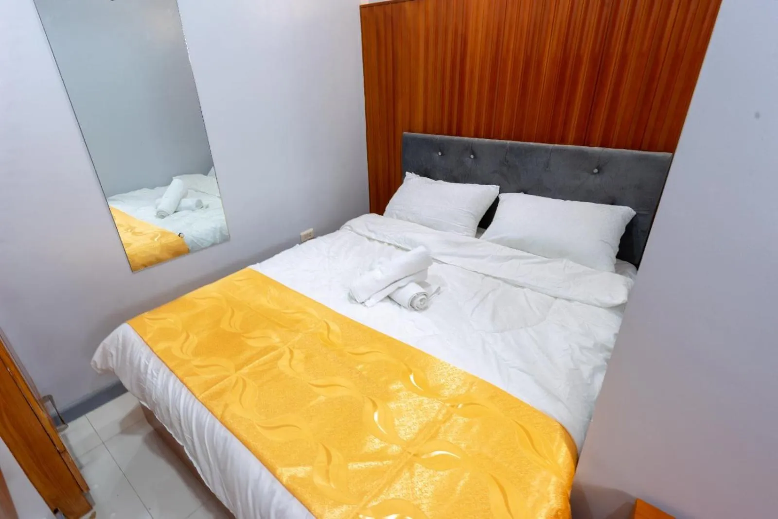 Bed in Grand Mercy Hotel