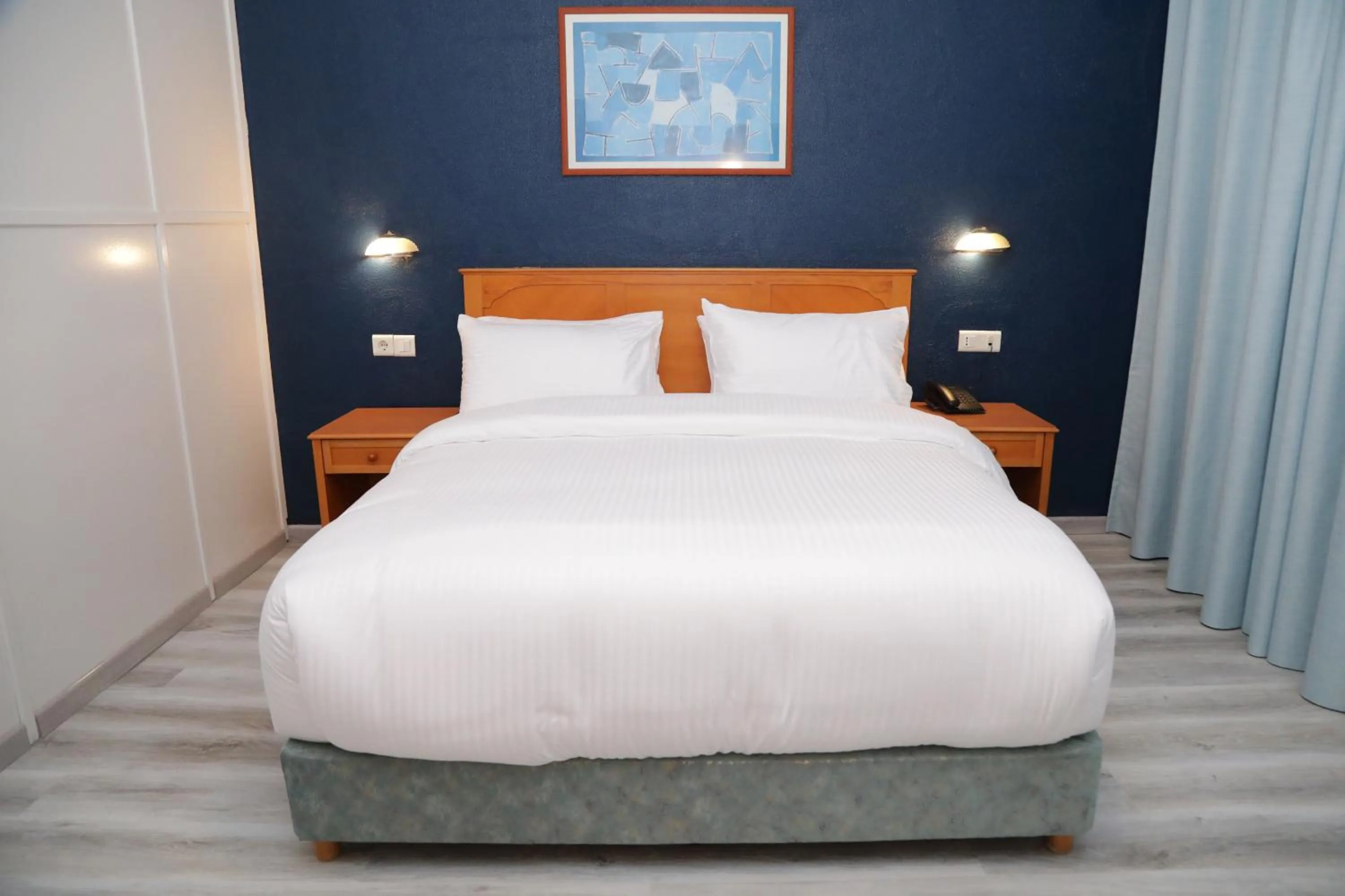 Bed in El Sheikh Suites Hotel