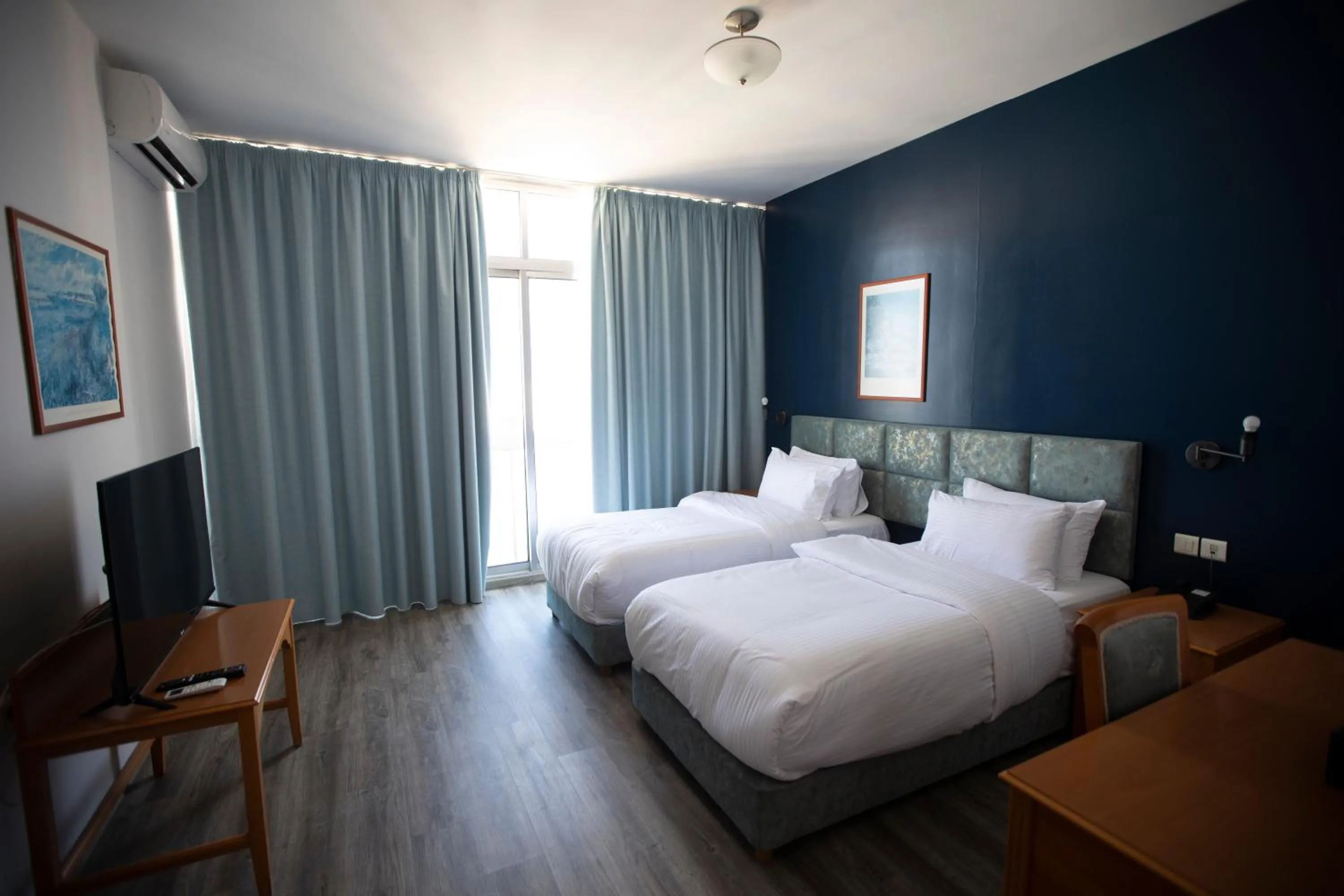 Bed in El Sheikh Suites Hotel