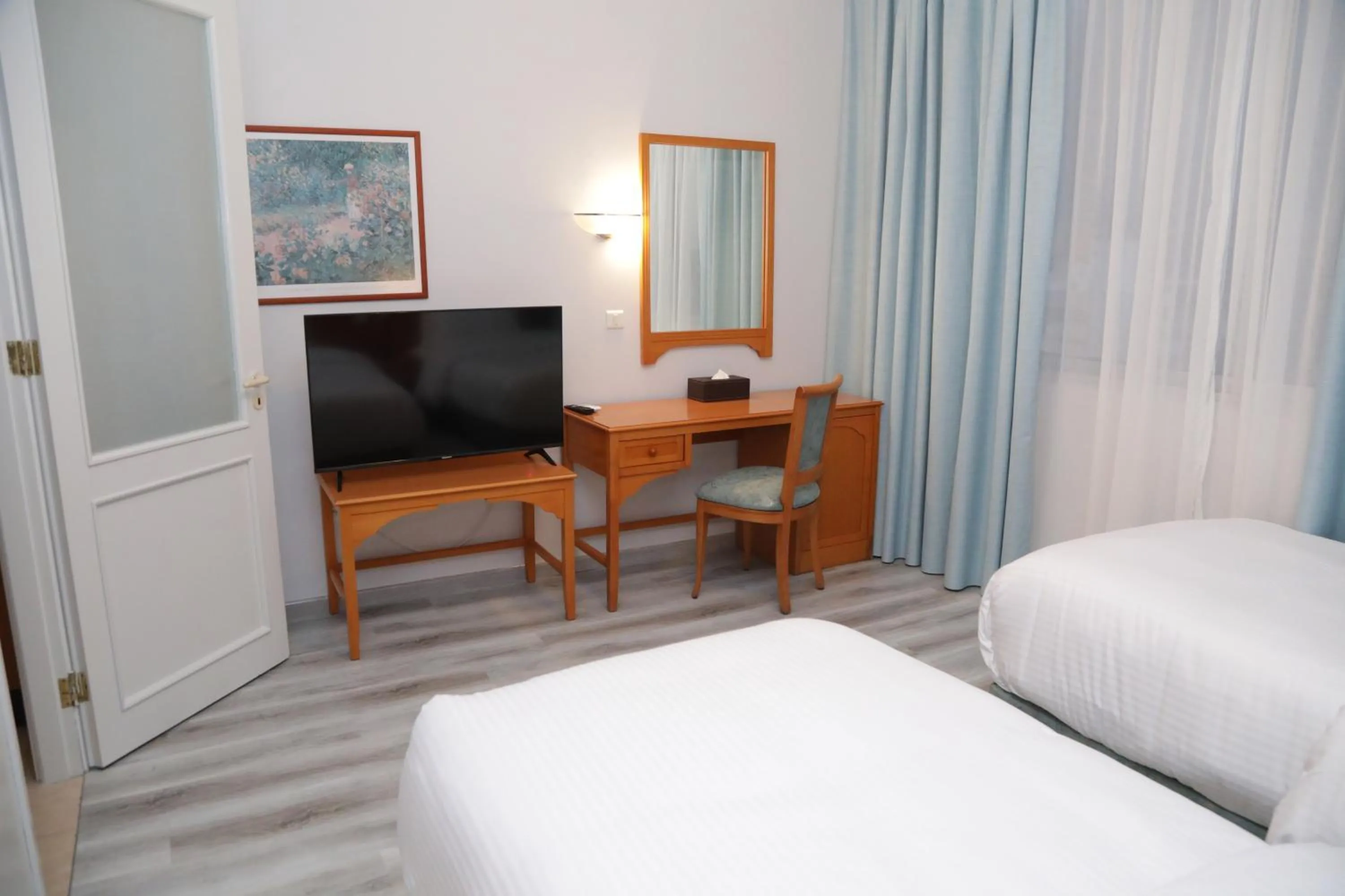 Bed in El Sheikh Suites Hotel