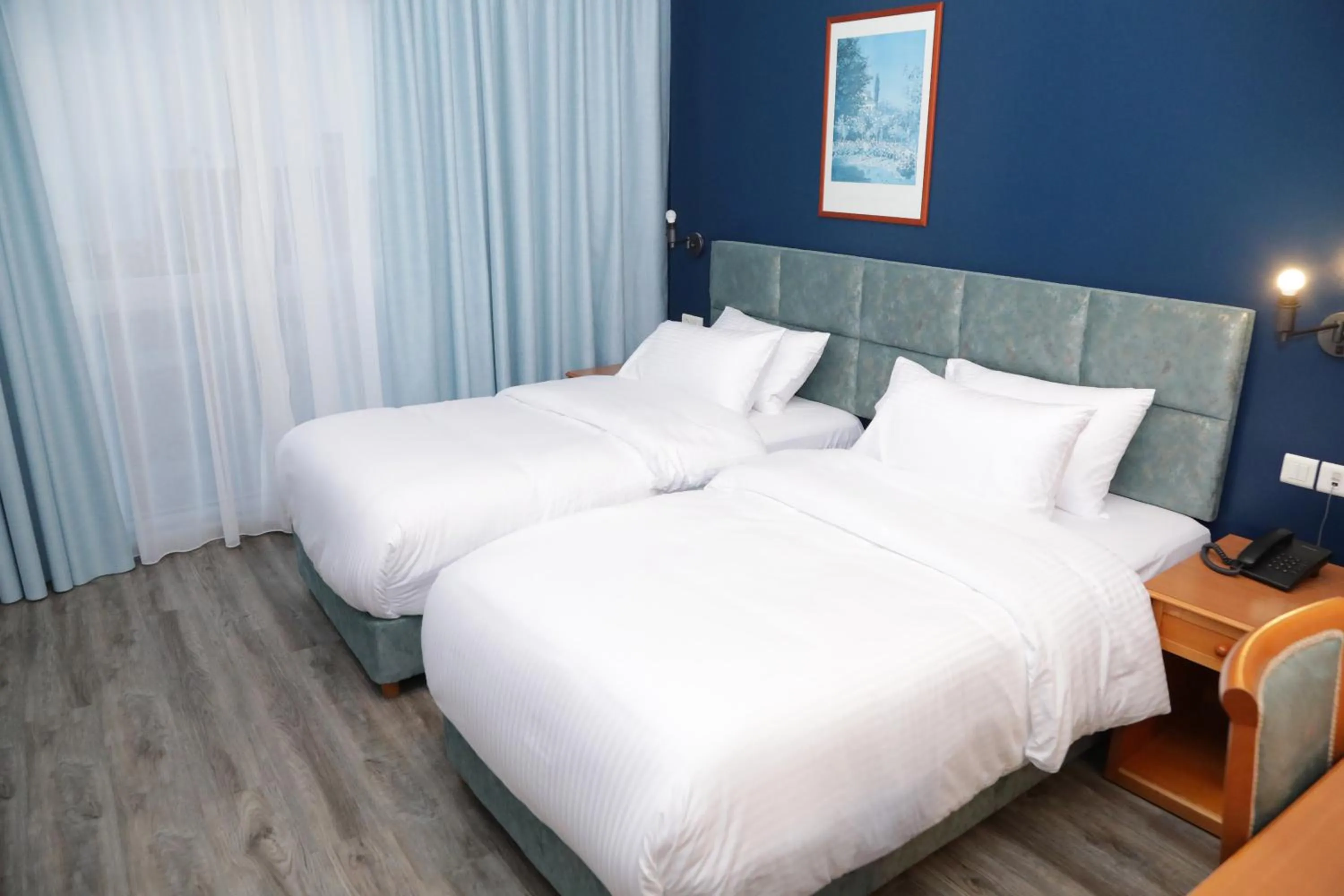 Bed in El Sheikh Suites Hotel