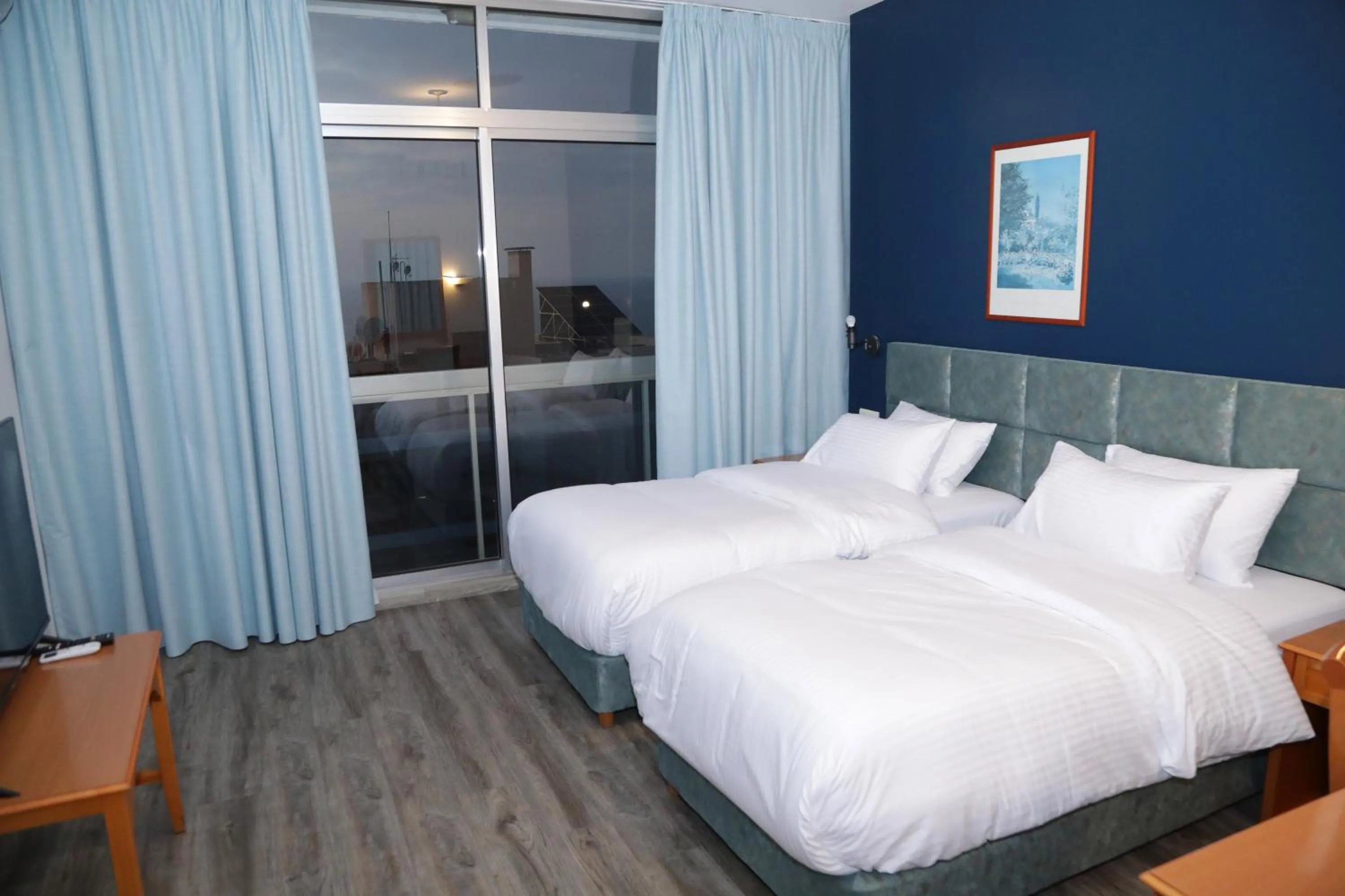 Bed in El Sheikh Suites Hotel