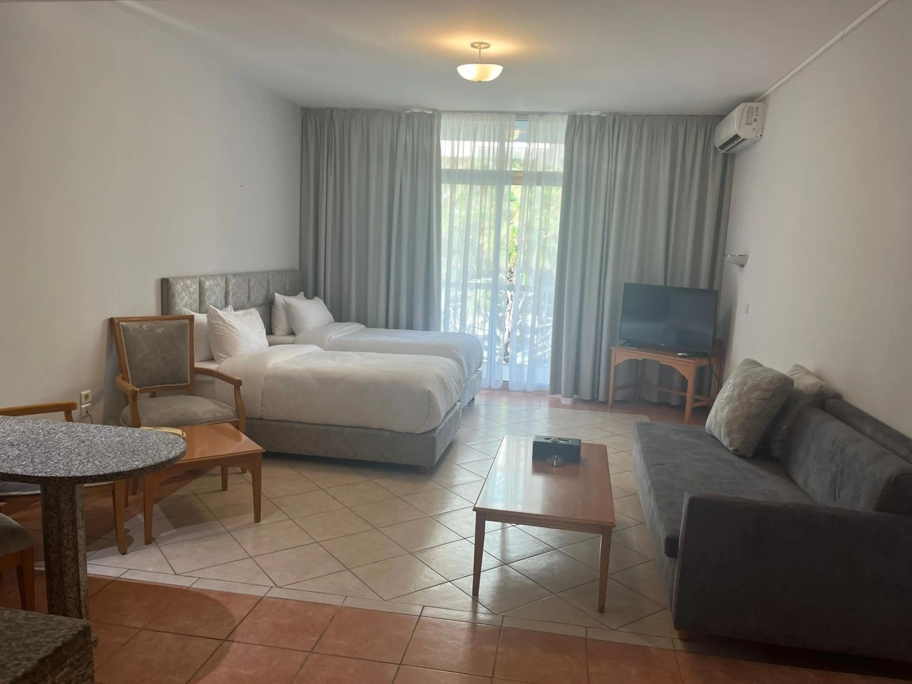 Bed in El Sheikh Suites Hotel