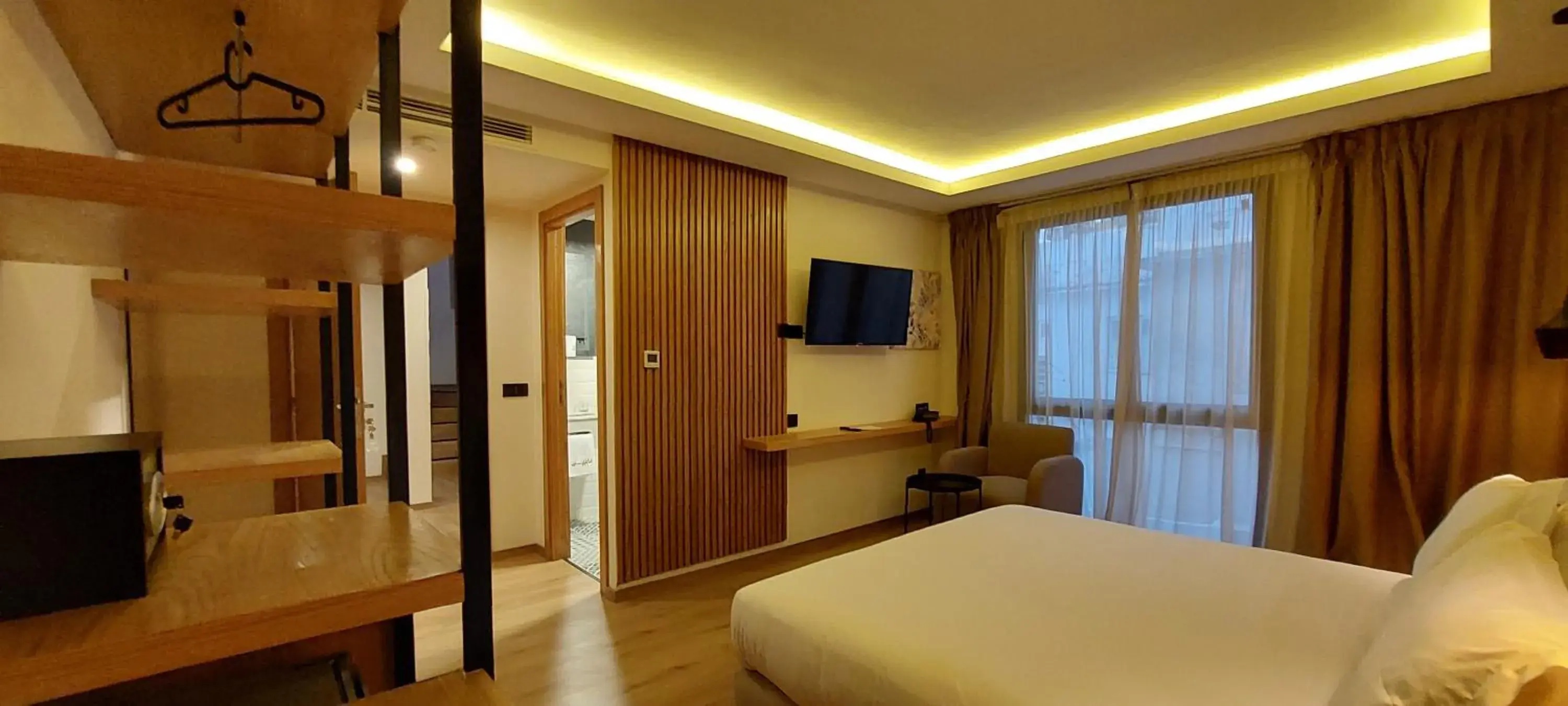 Communal lounge/ TV room, Bed in Unico Hotel & Spa Casablanca Communal lounge/ TV room, Bed in Unico Hotel & Spa Casablanca