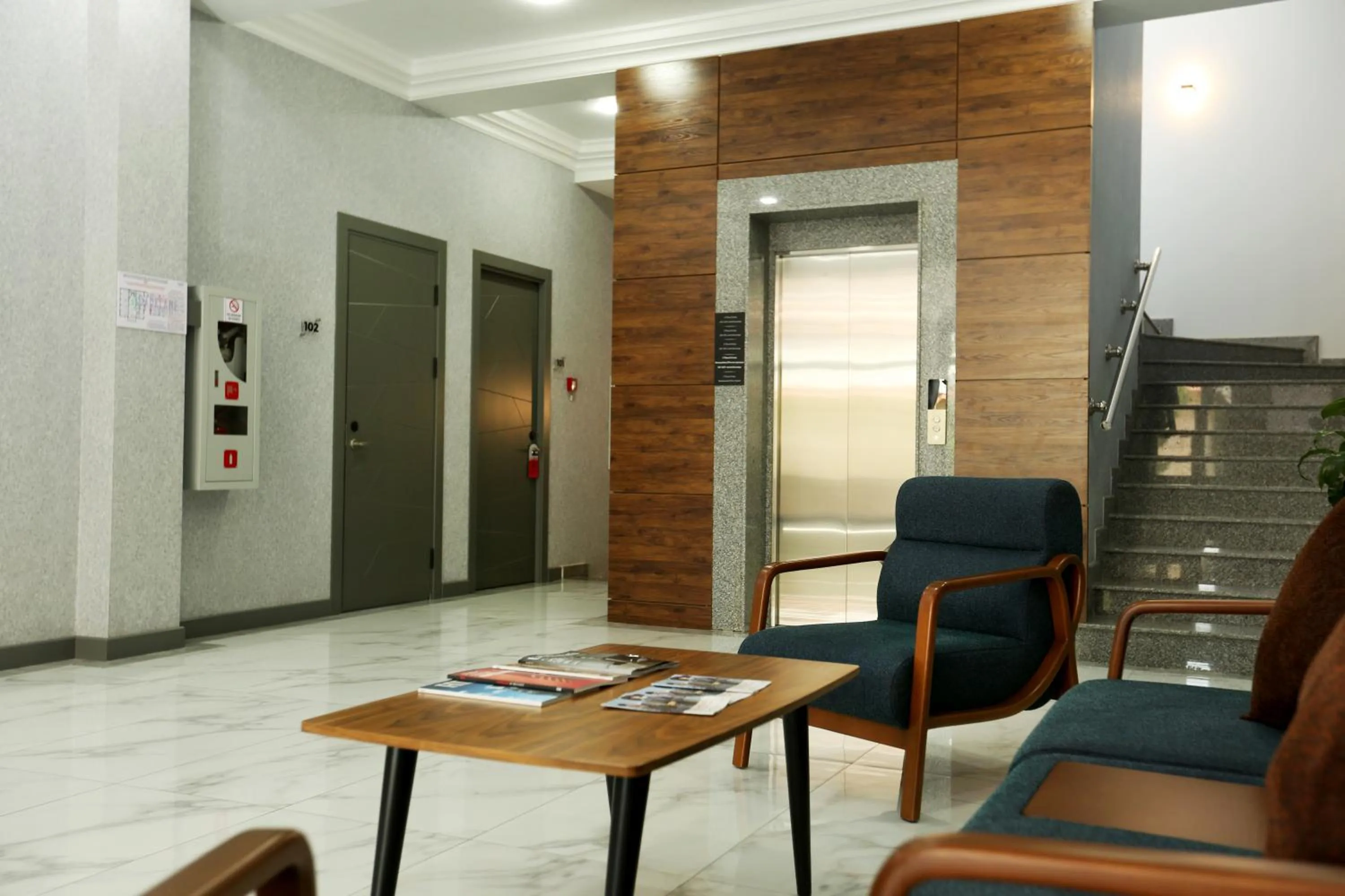 Communal lounge/ TV room in Parklane Hotel