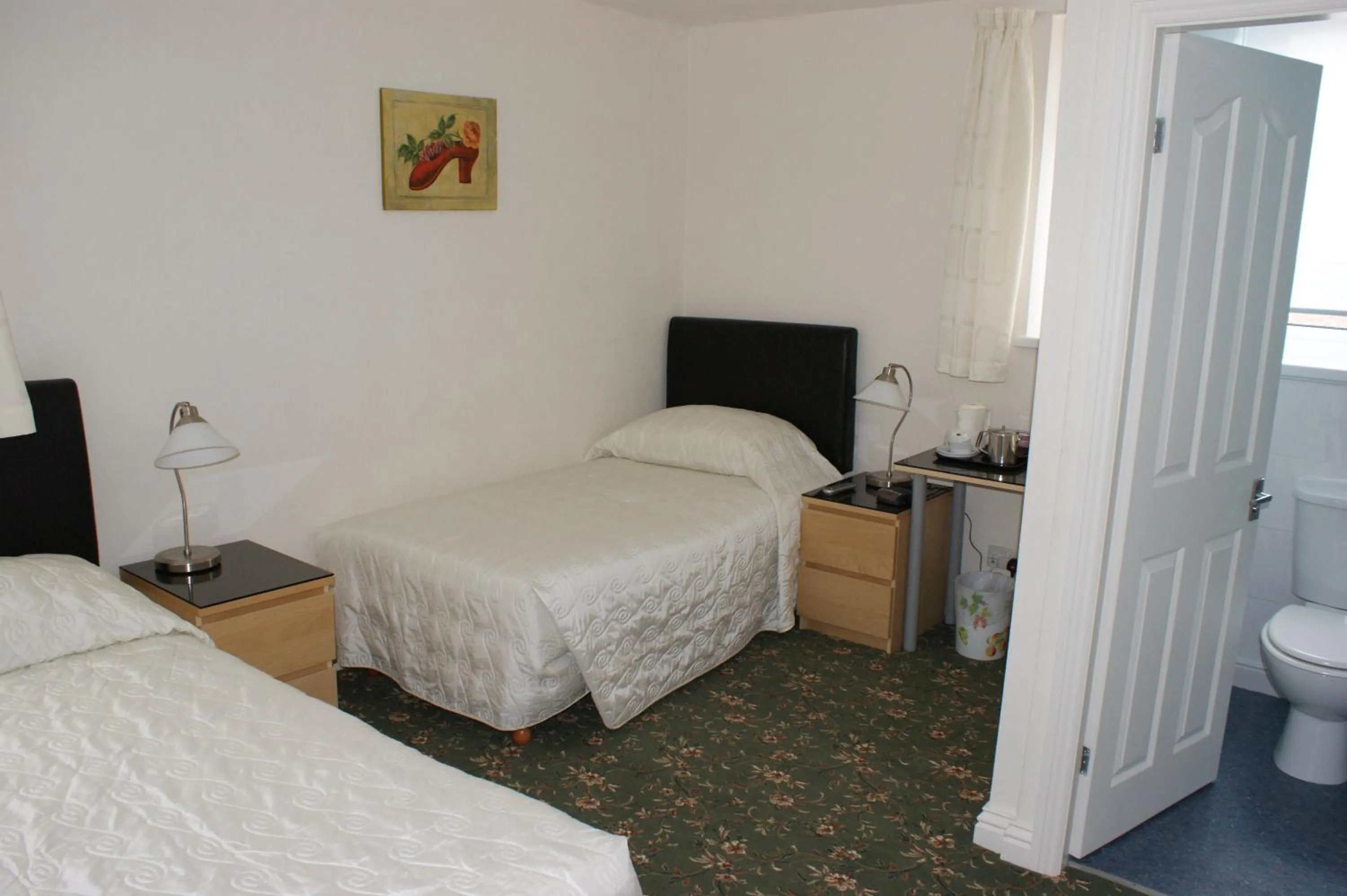 Bed in Beachcomber Hotel