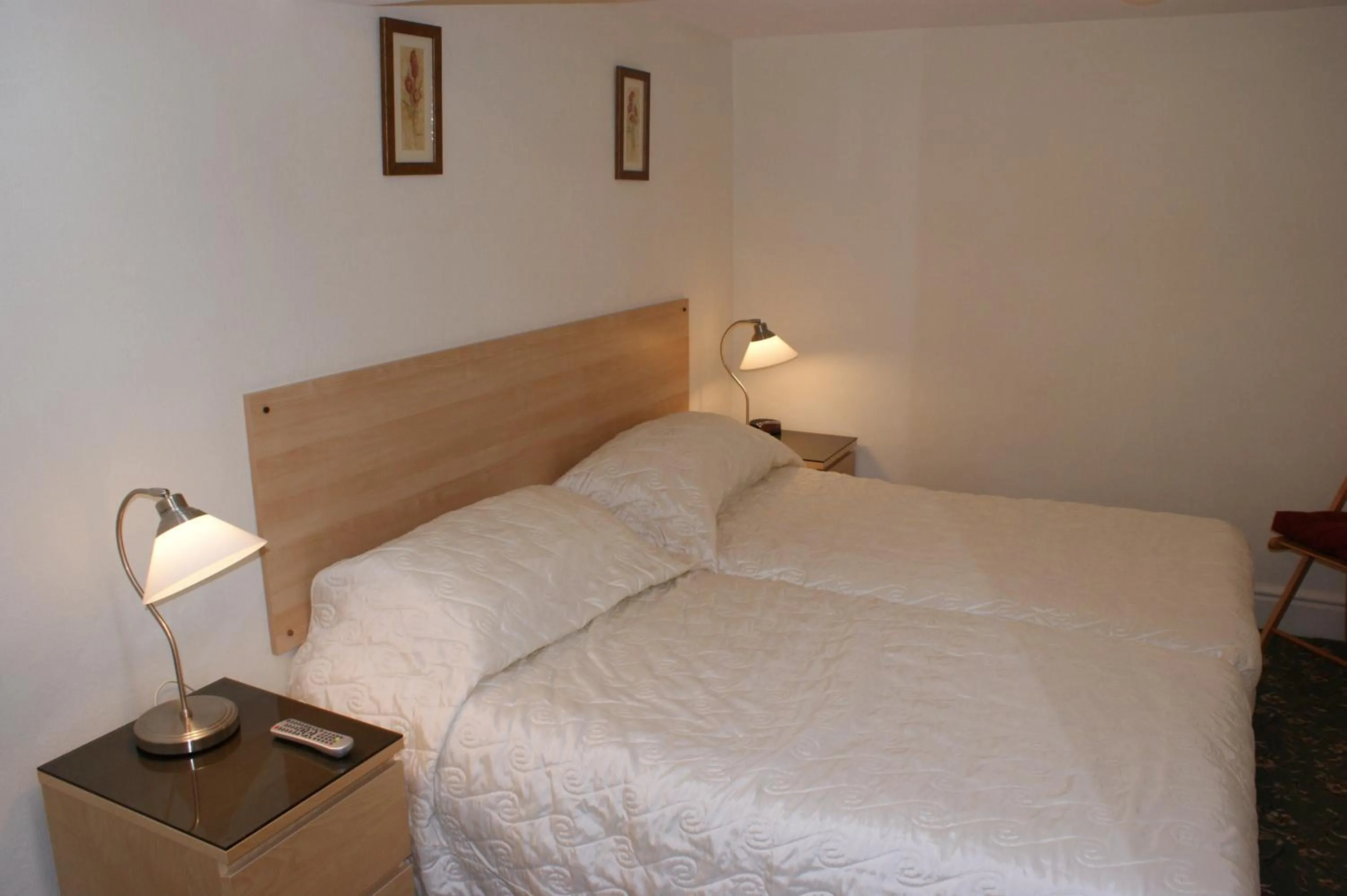 Bed in Beachcomber Hotel