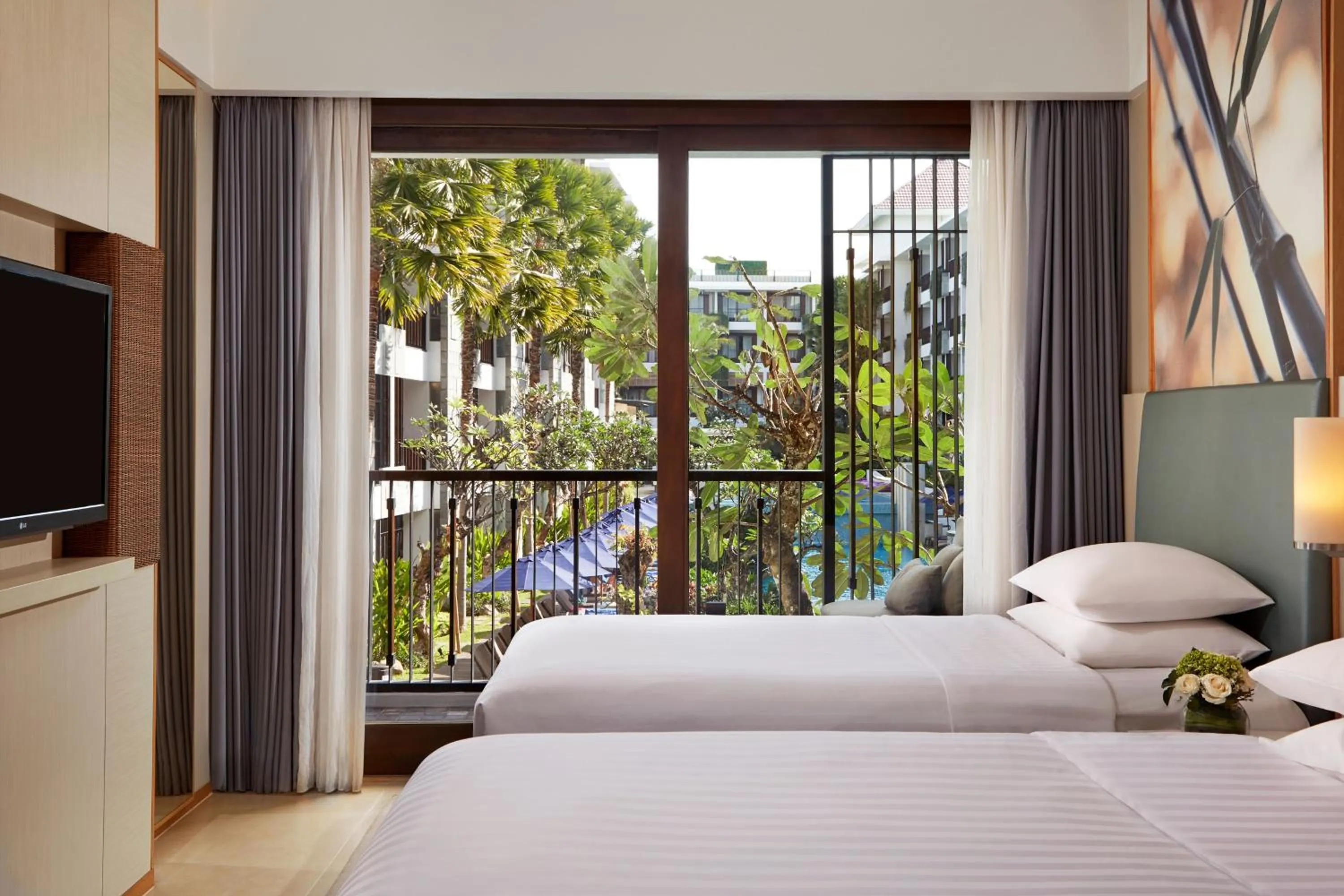Bed in Courtyard by Marriott Bali Seminyak Resort