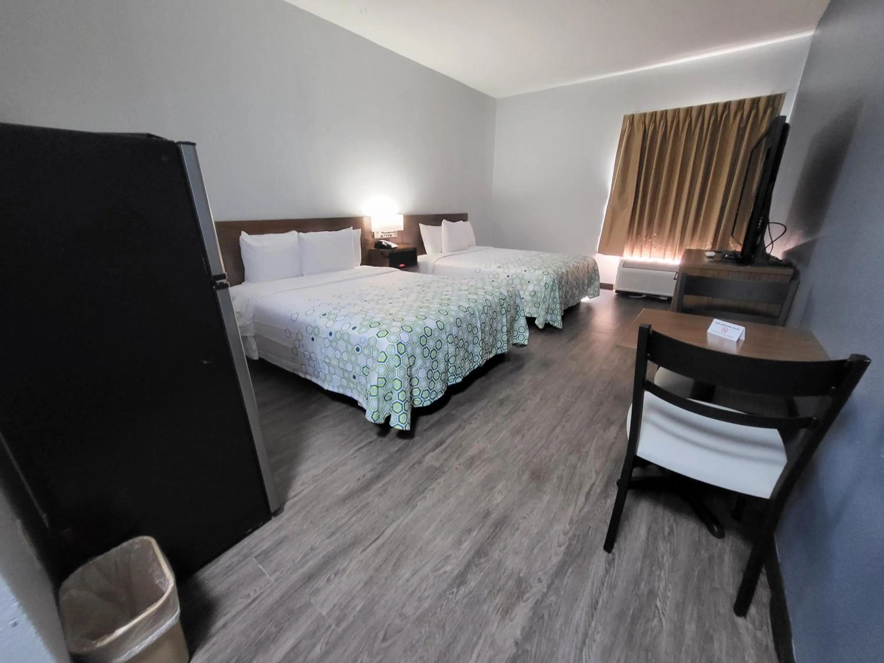 Bedroom in HomeTowne Studios by Red Roof Prattville