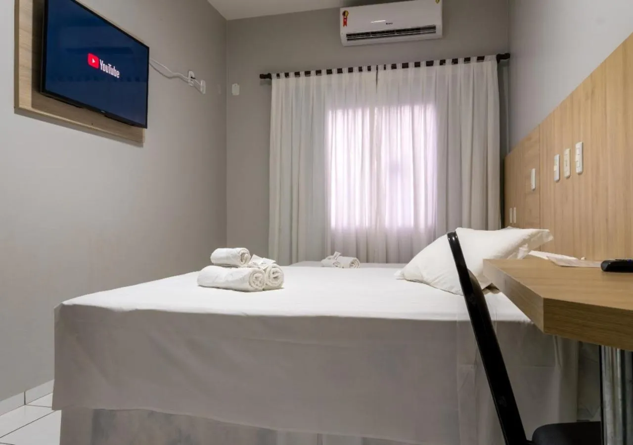 Bed in FLORENÇA PALACE HOTEL