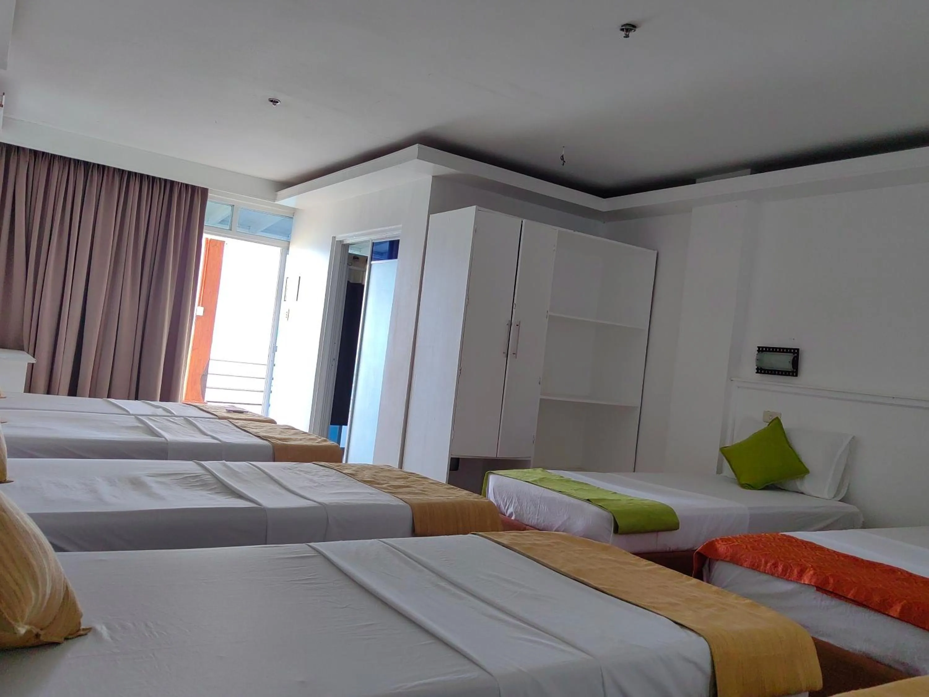 Bed in Orange Pearl Beach Resort