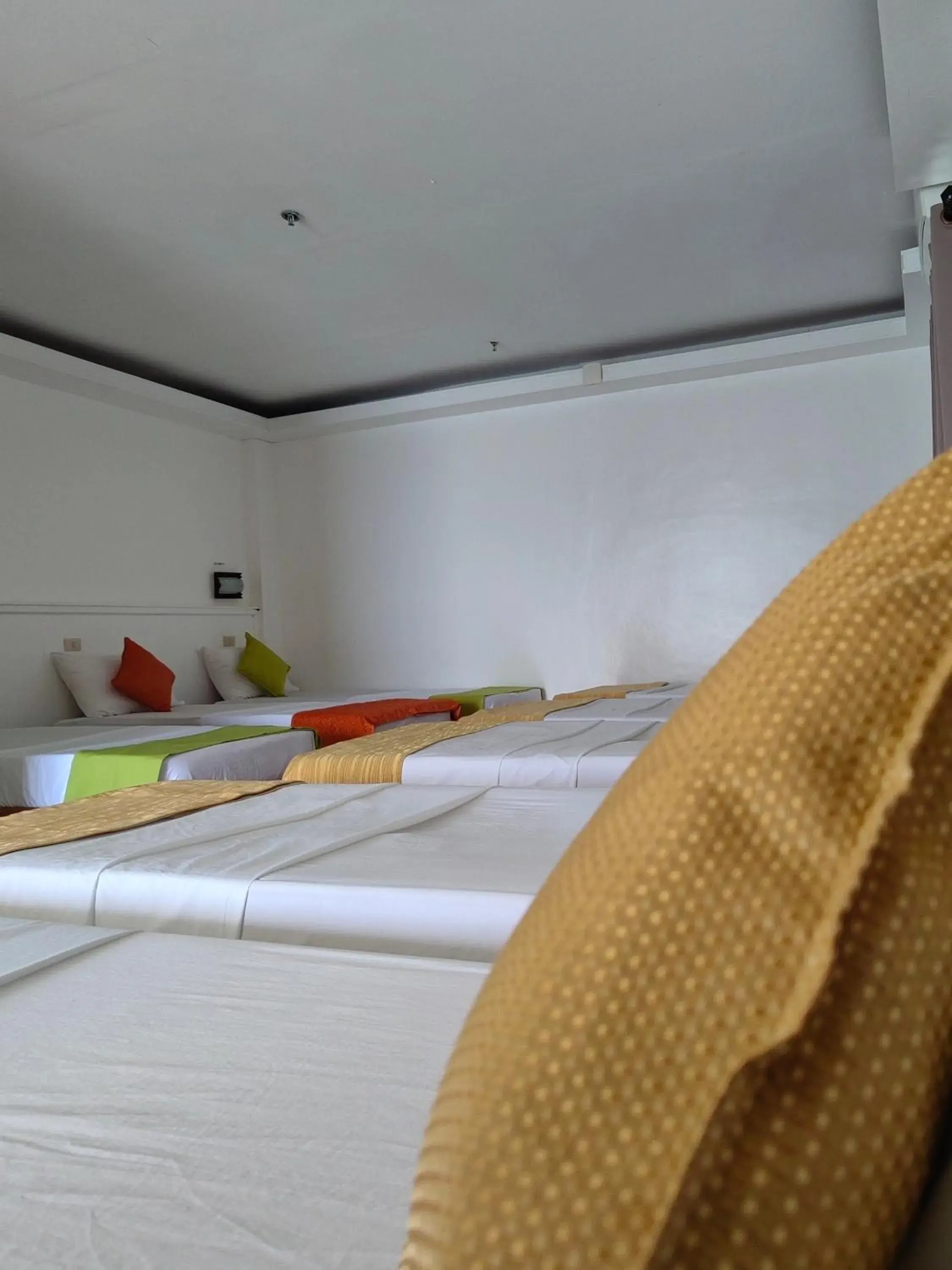 Bed in Orange Pearl Beach Resort Bed in Orange Pearl Beach Resort