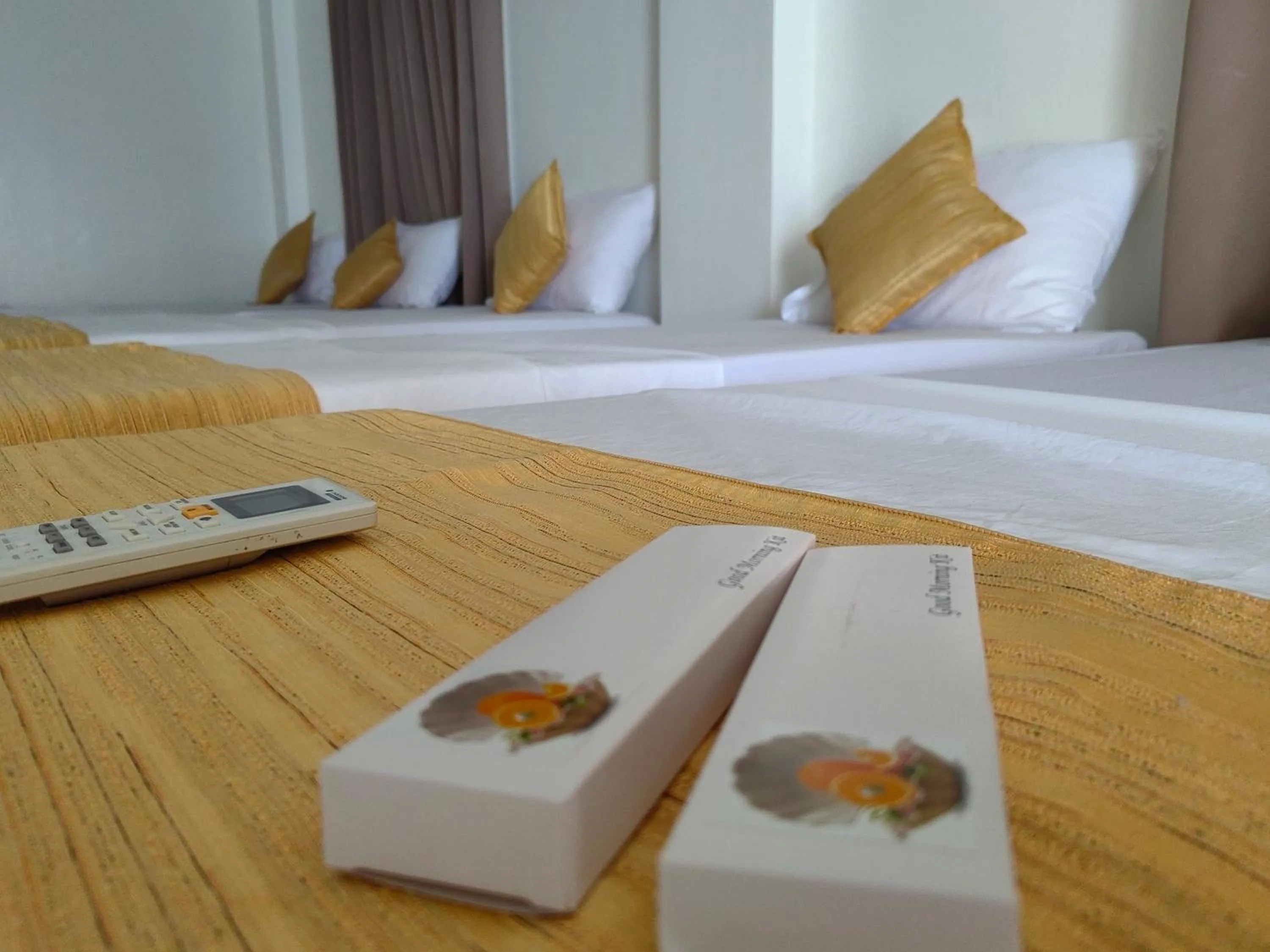 Bed in Orange Pearl Beach Resort