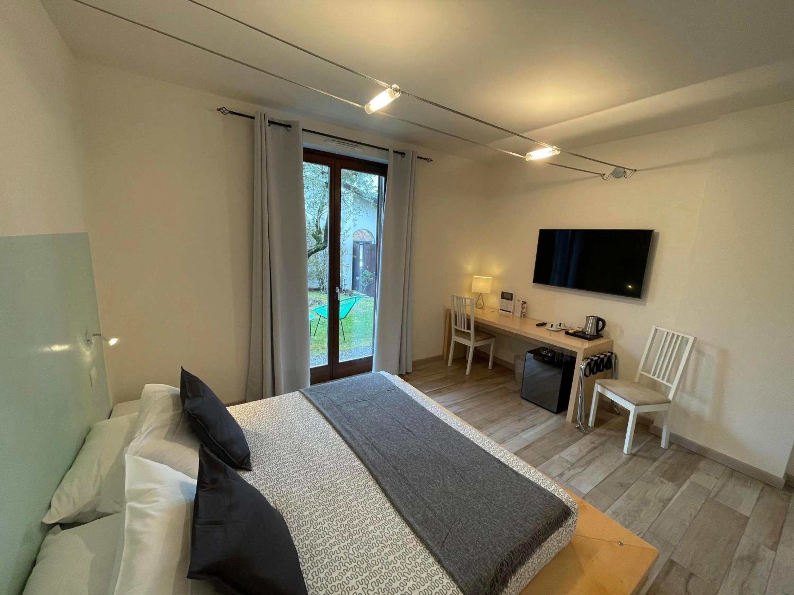 Bed in Charming Bellagio Boutique Hotel