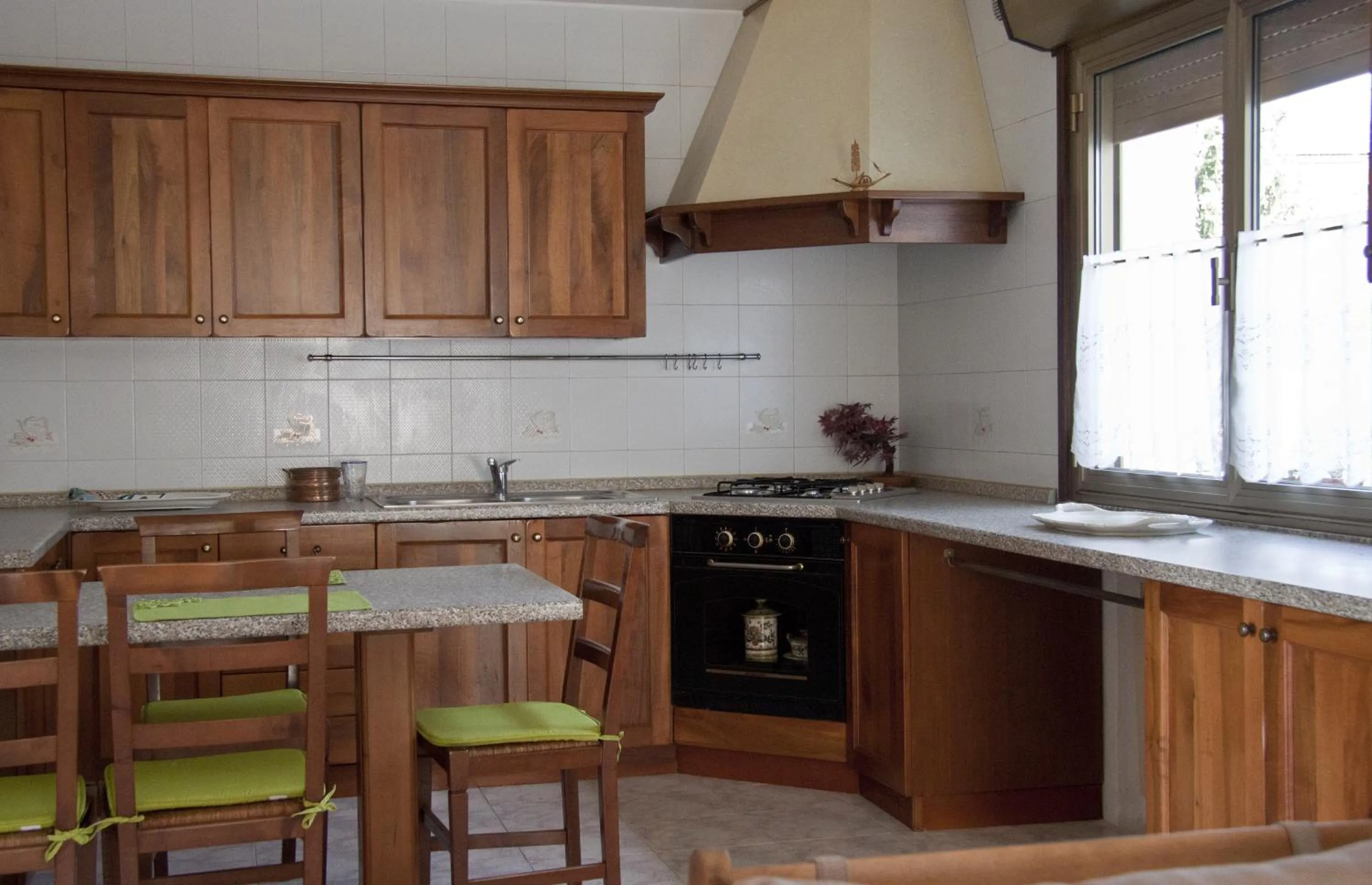Communal kitchen in B&B A Un Passo Da