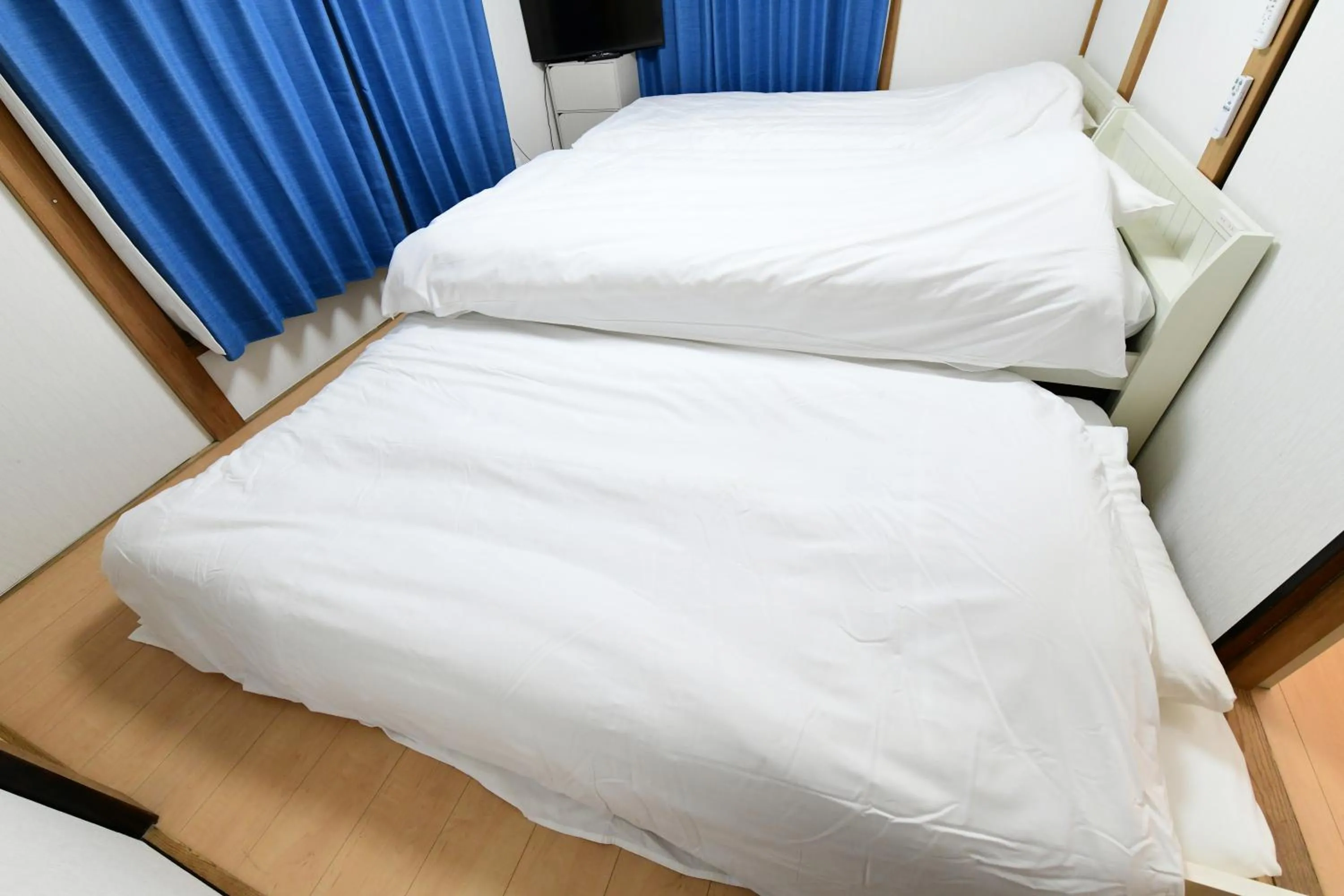 Bed in JH Yellow Guest House