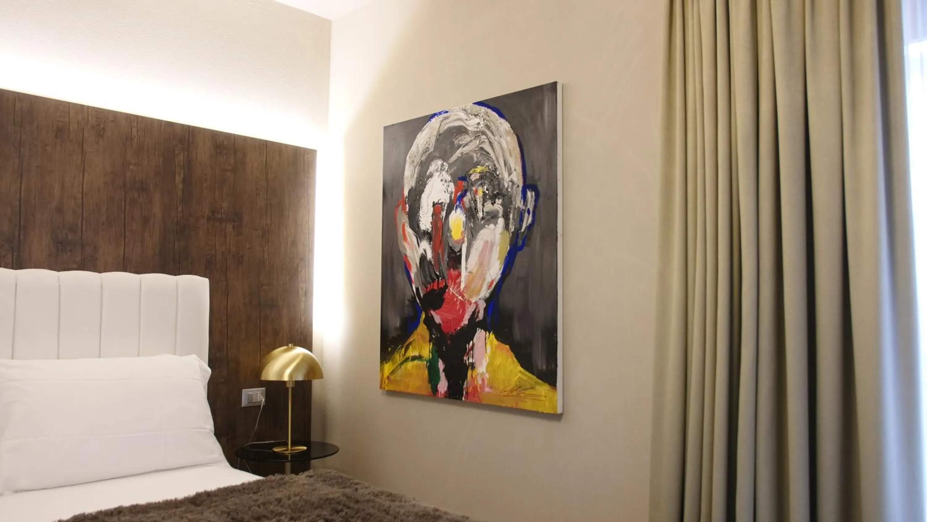 Decorative detail, Bed in Hotel Battisti 31