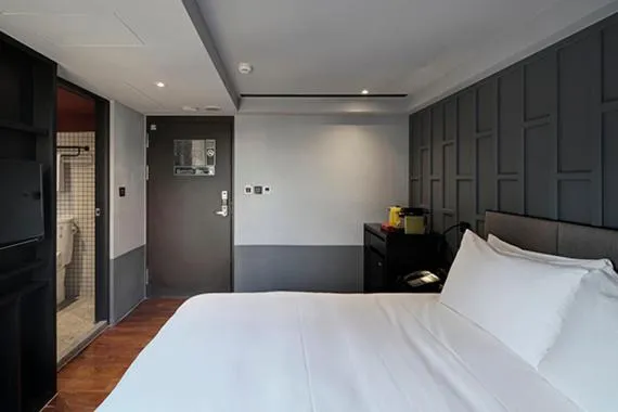 Bed in Reddot Hotel