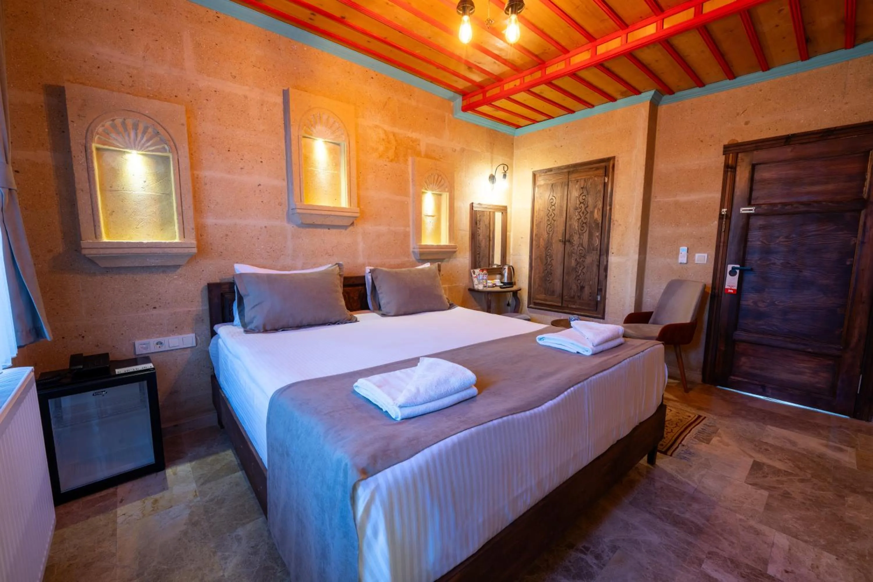 Photo of the whole room, Bed in Rustic Caves