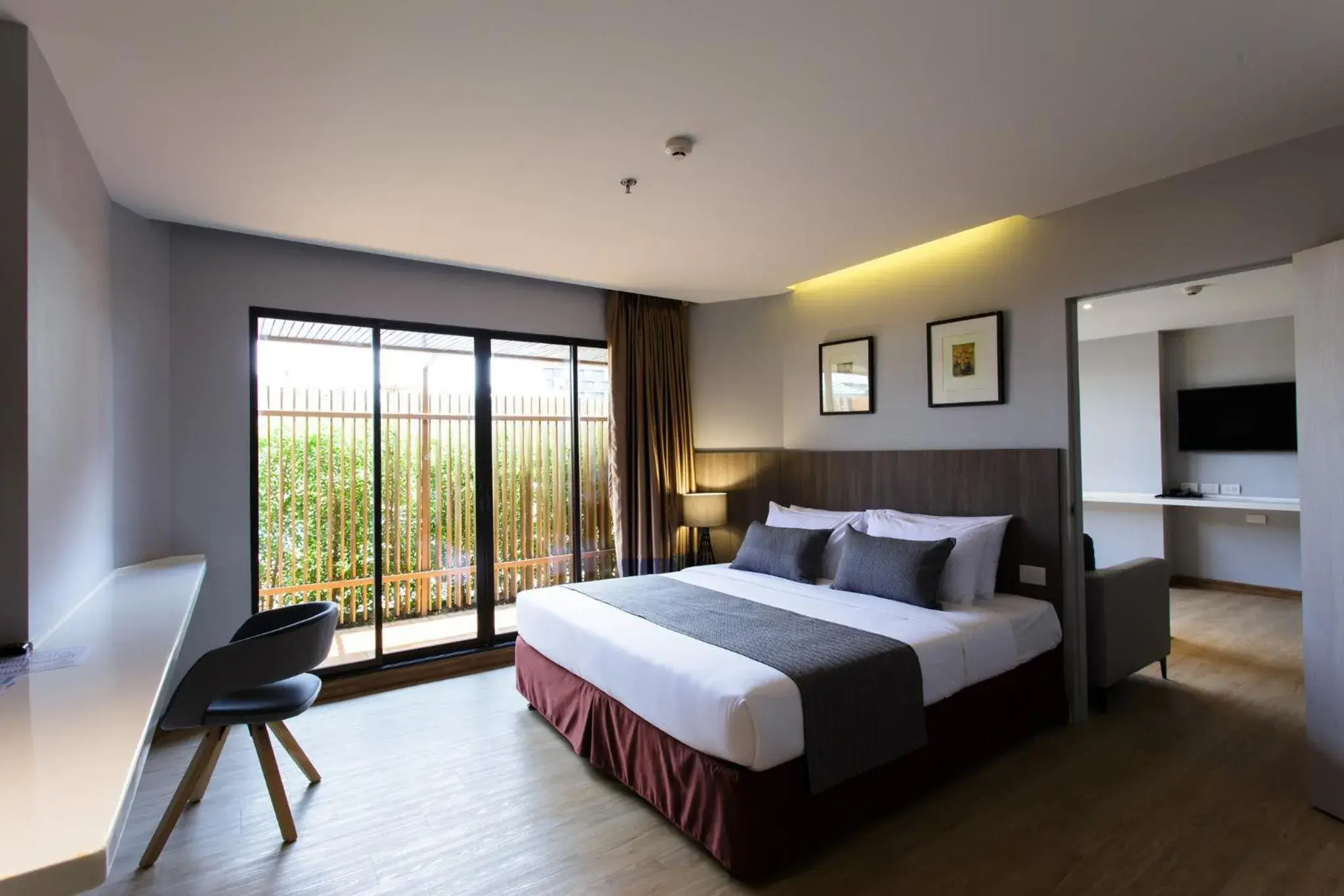 Communal lounge/ TV room, Bed in Jazzotel Bangkok Communal lounge/ TV room, Bed in Jazzotel Bangkok