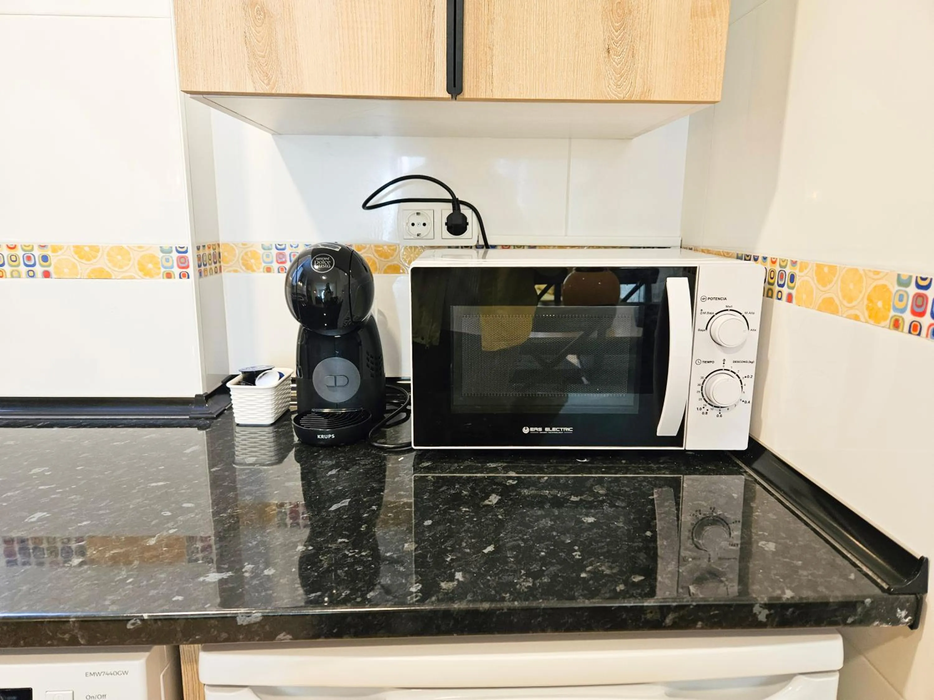 Kitchen or kitchenette in Apartamentos Escarrilla Suites 3000