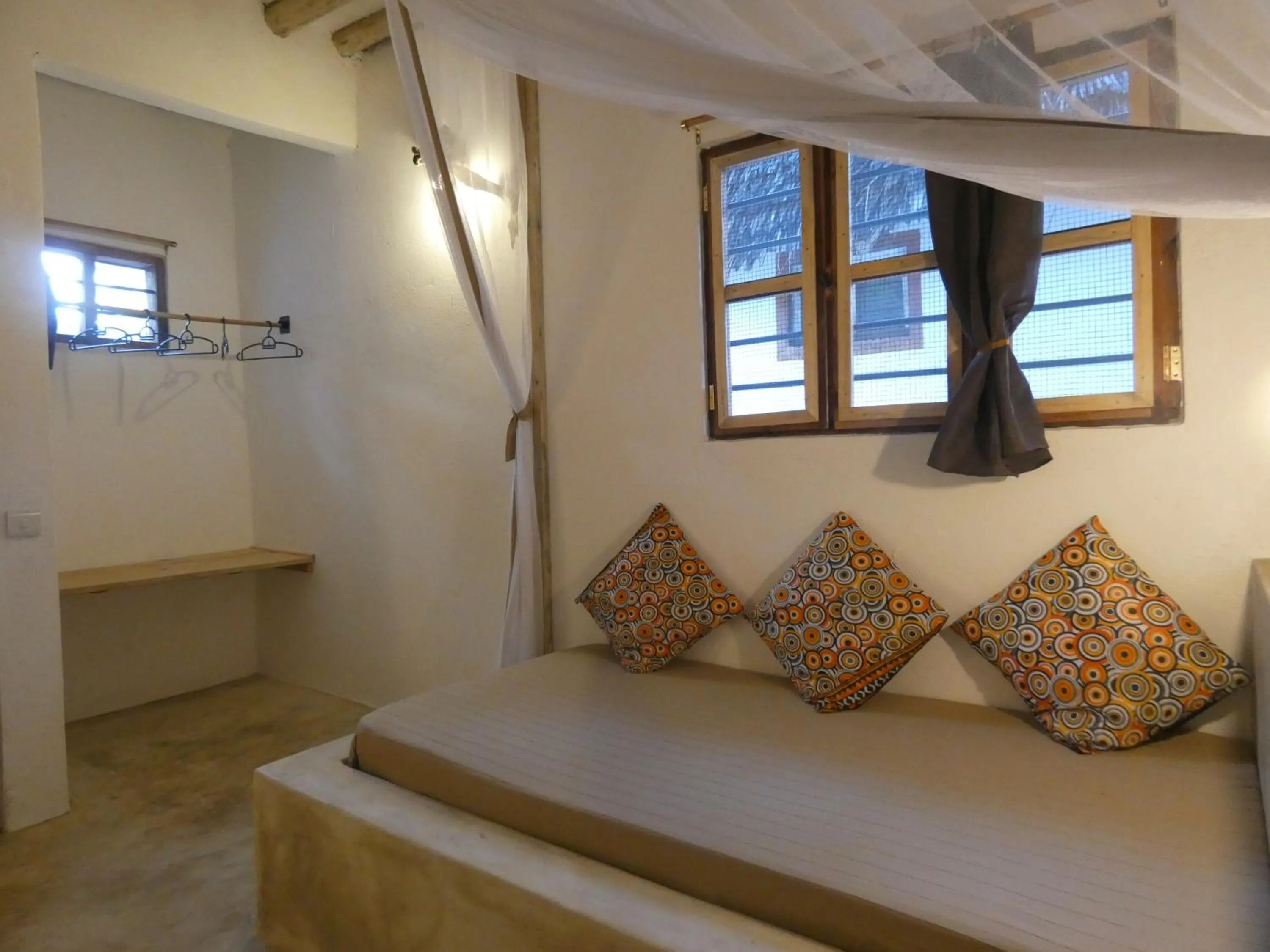 Bed in Bahari Beach Bungalows