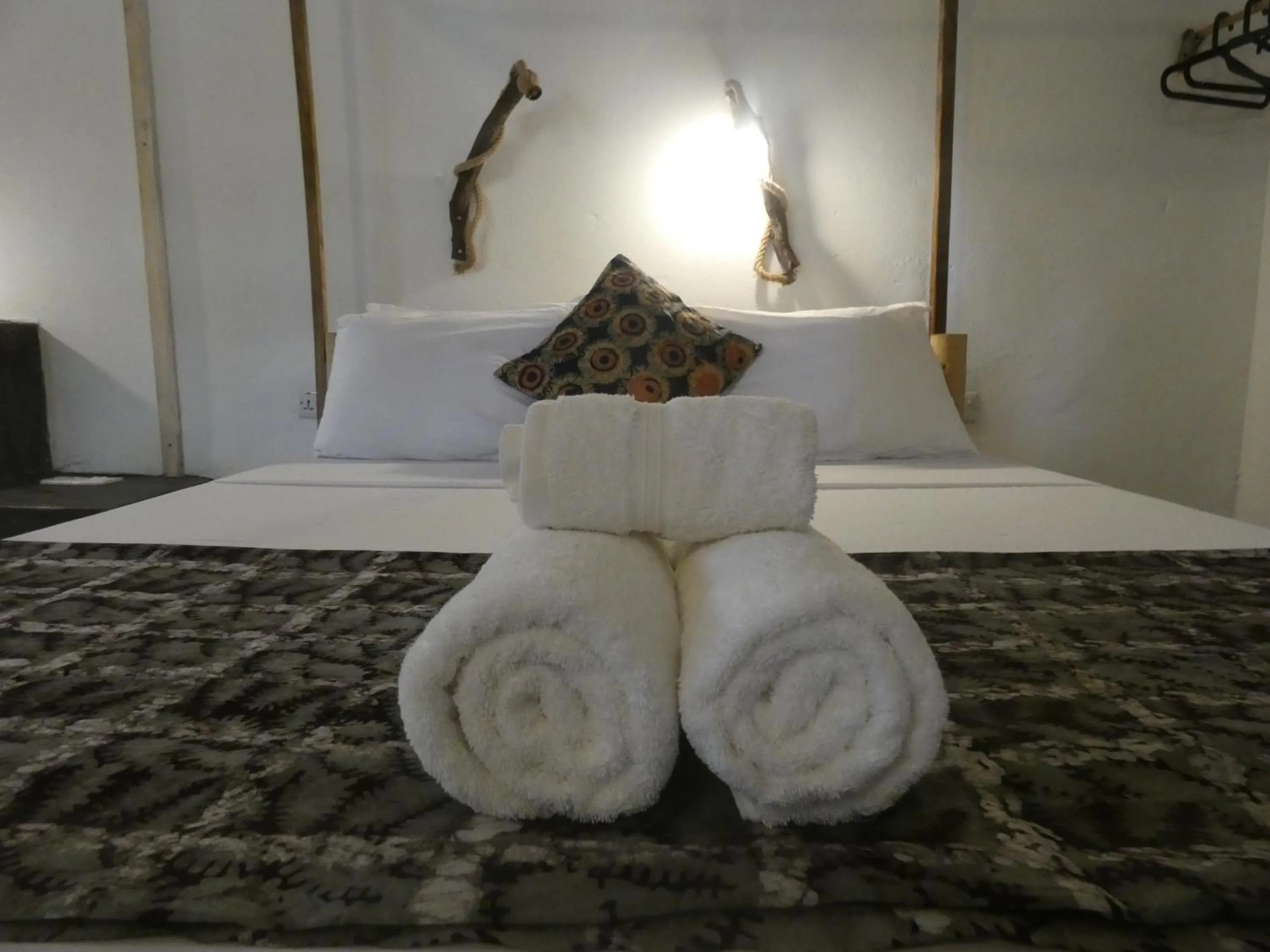 Bed in Bahari Beach Bungalows