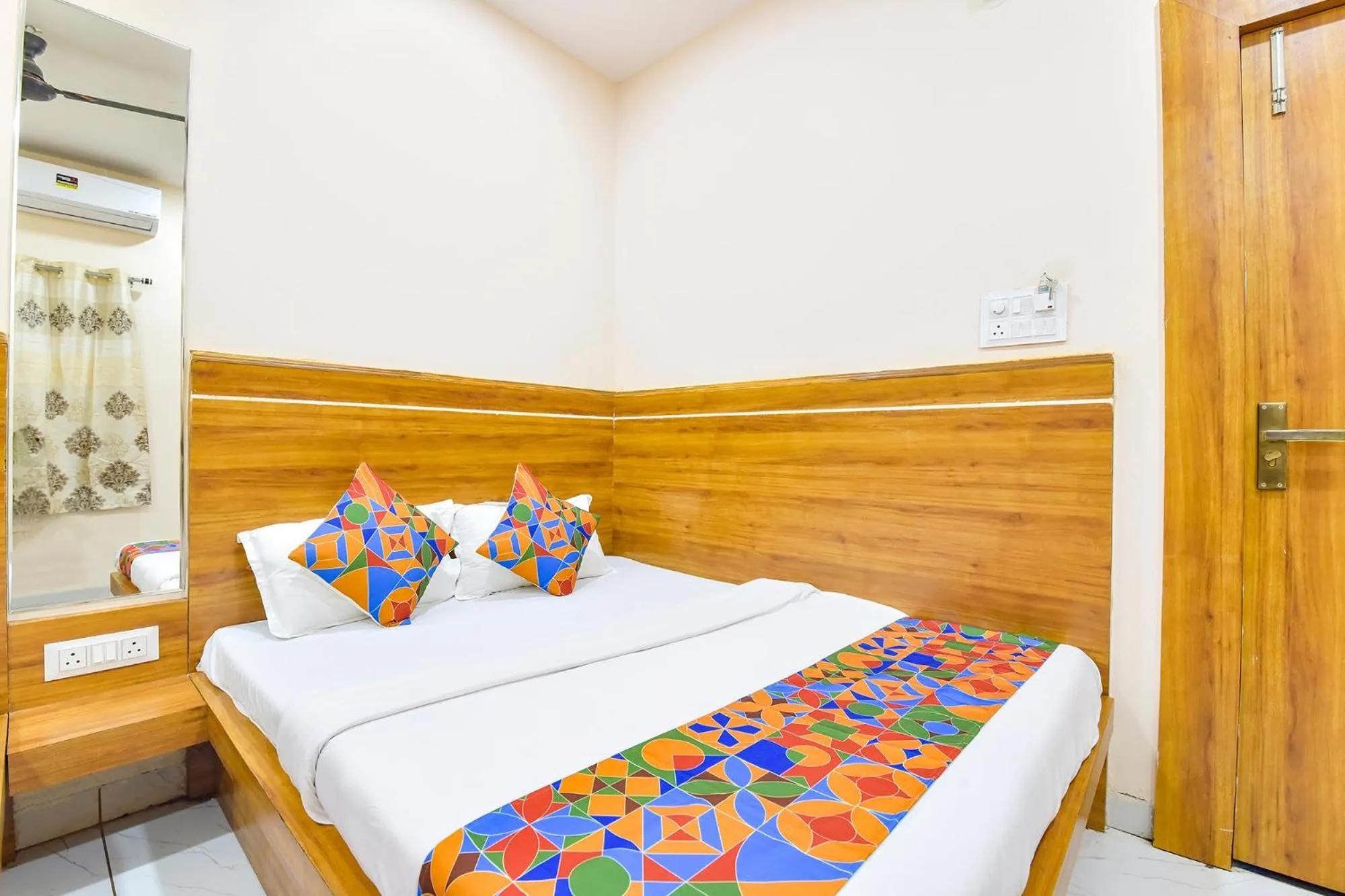 Bed in FabHotel Somnath