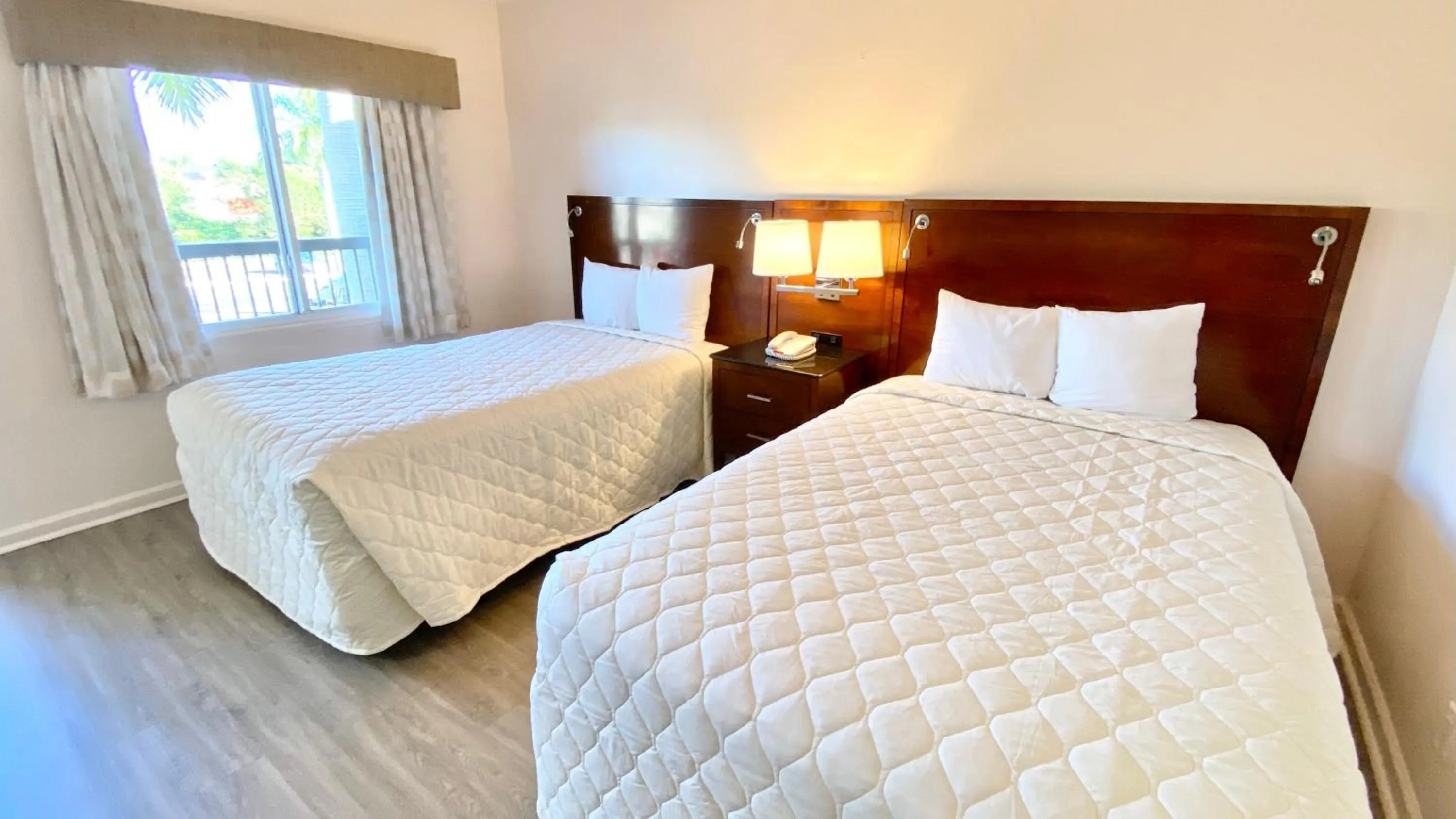 Bed in Royal Inn Hotel