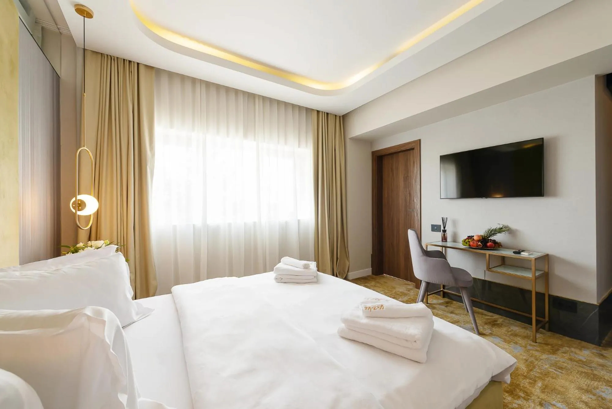 Bed in Yasu Luxury Rooms