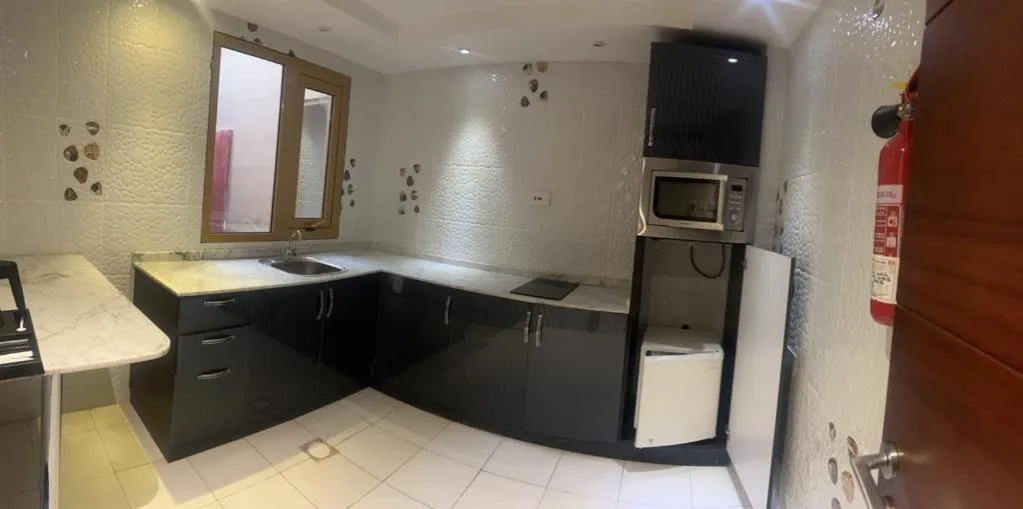 Kitchen or kitchenette in SADARA HOTELS APARTMENTS