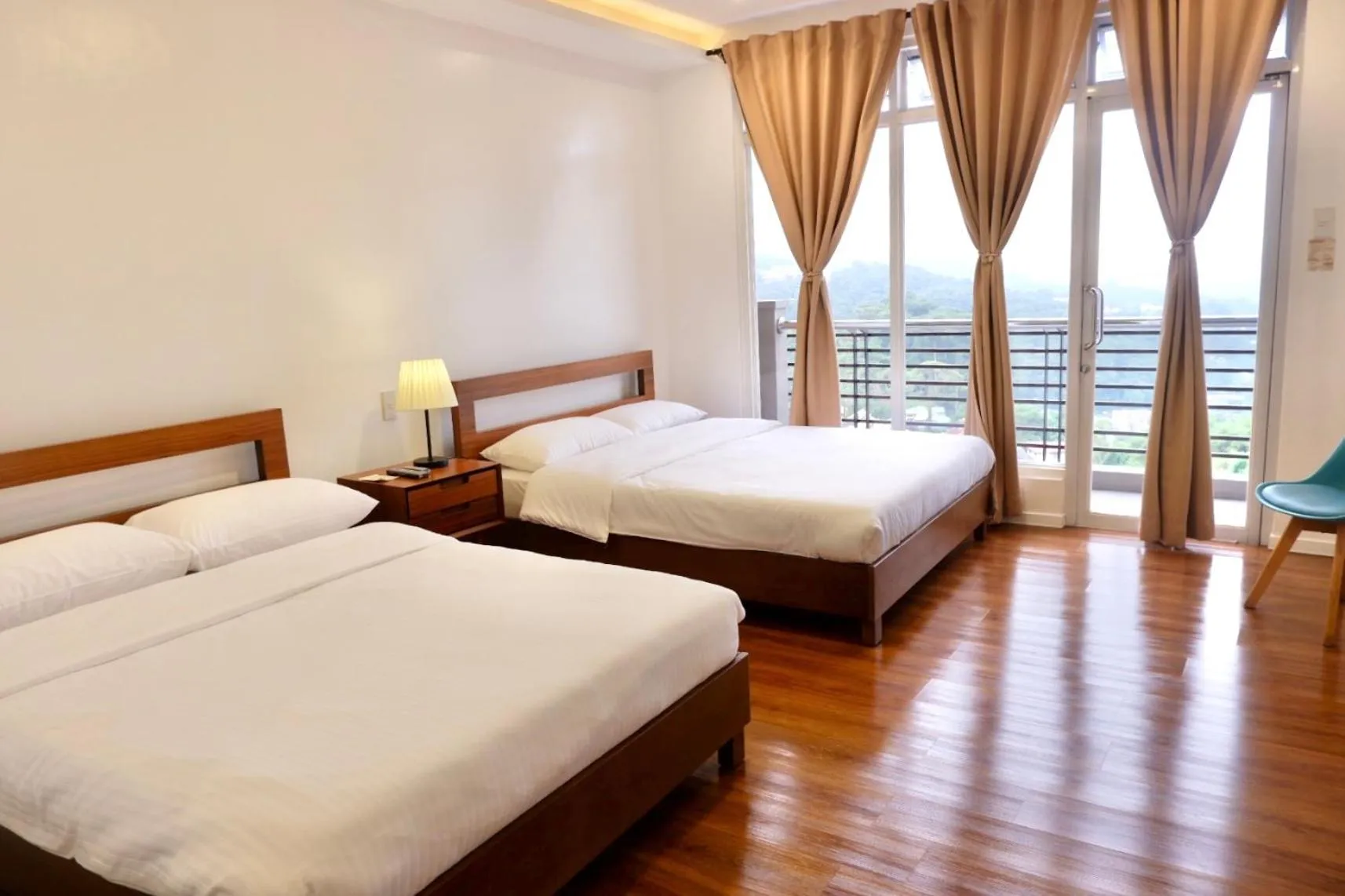 Photo of the whole room, Bed in ECCO Suites Baguio